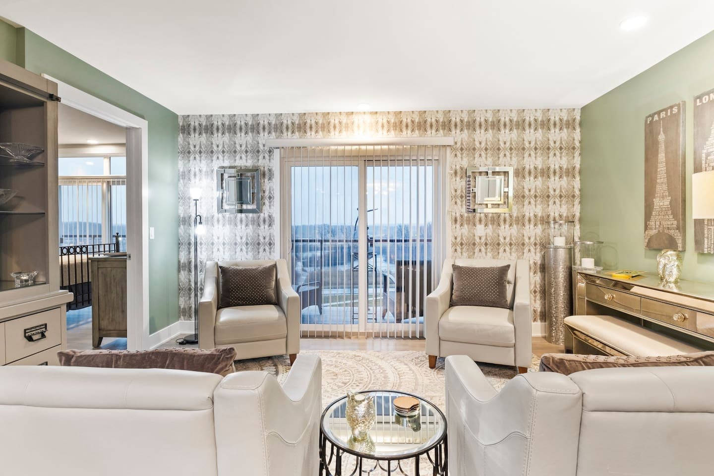 Living room with glass door to private balcony access