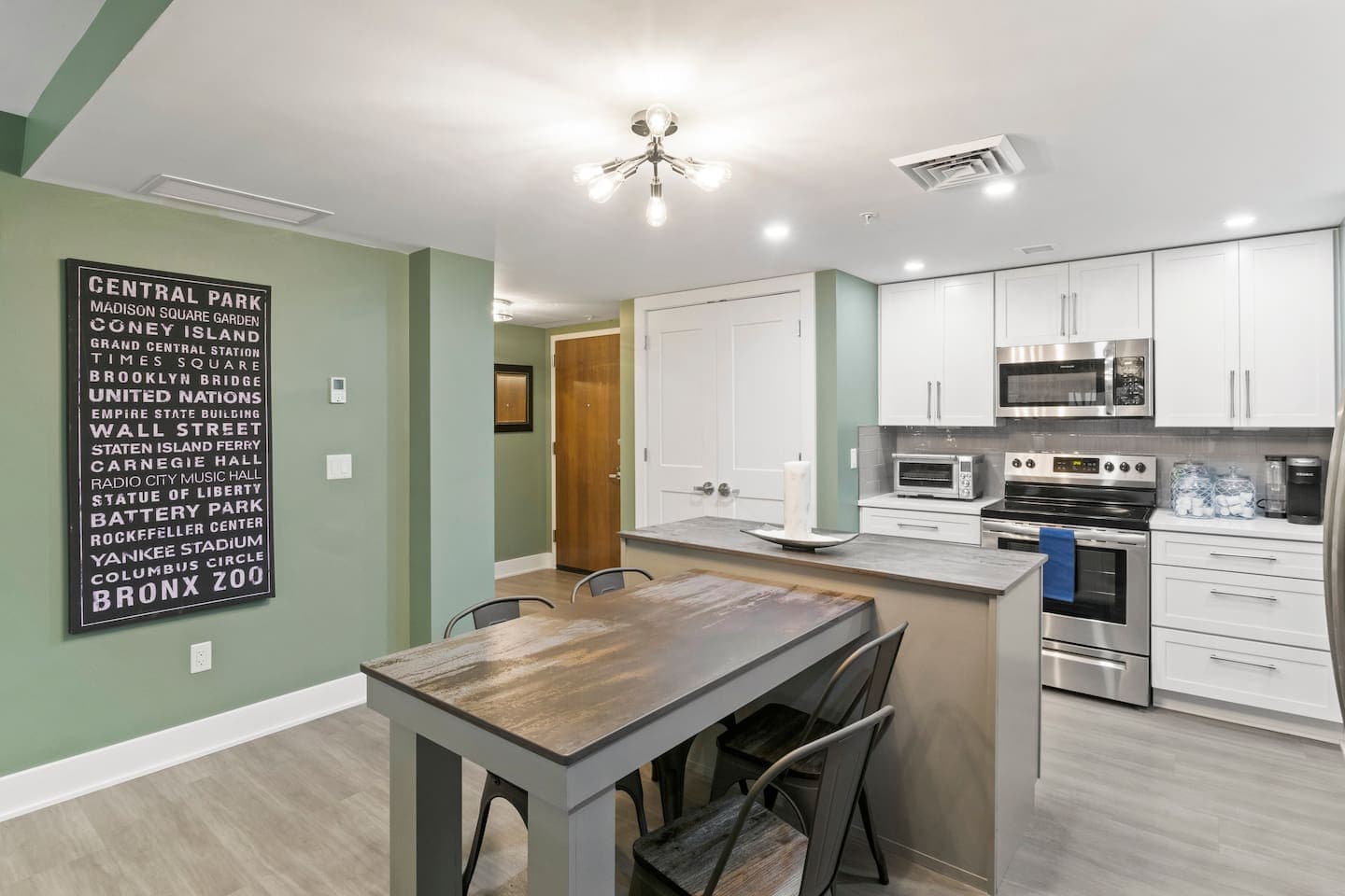 Modern kitchen with white cabinetry and island