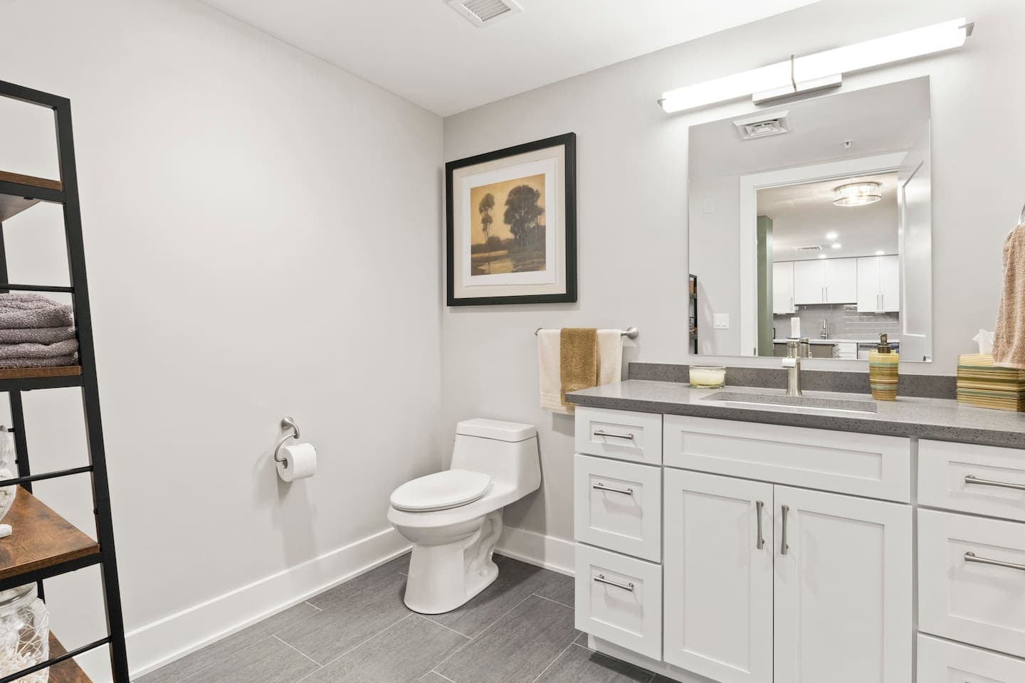 Bathroom with white vanity and walk-in shower