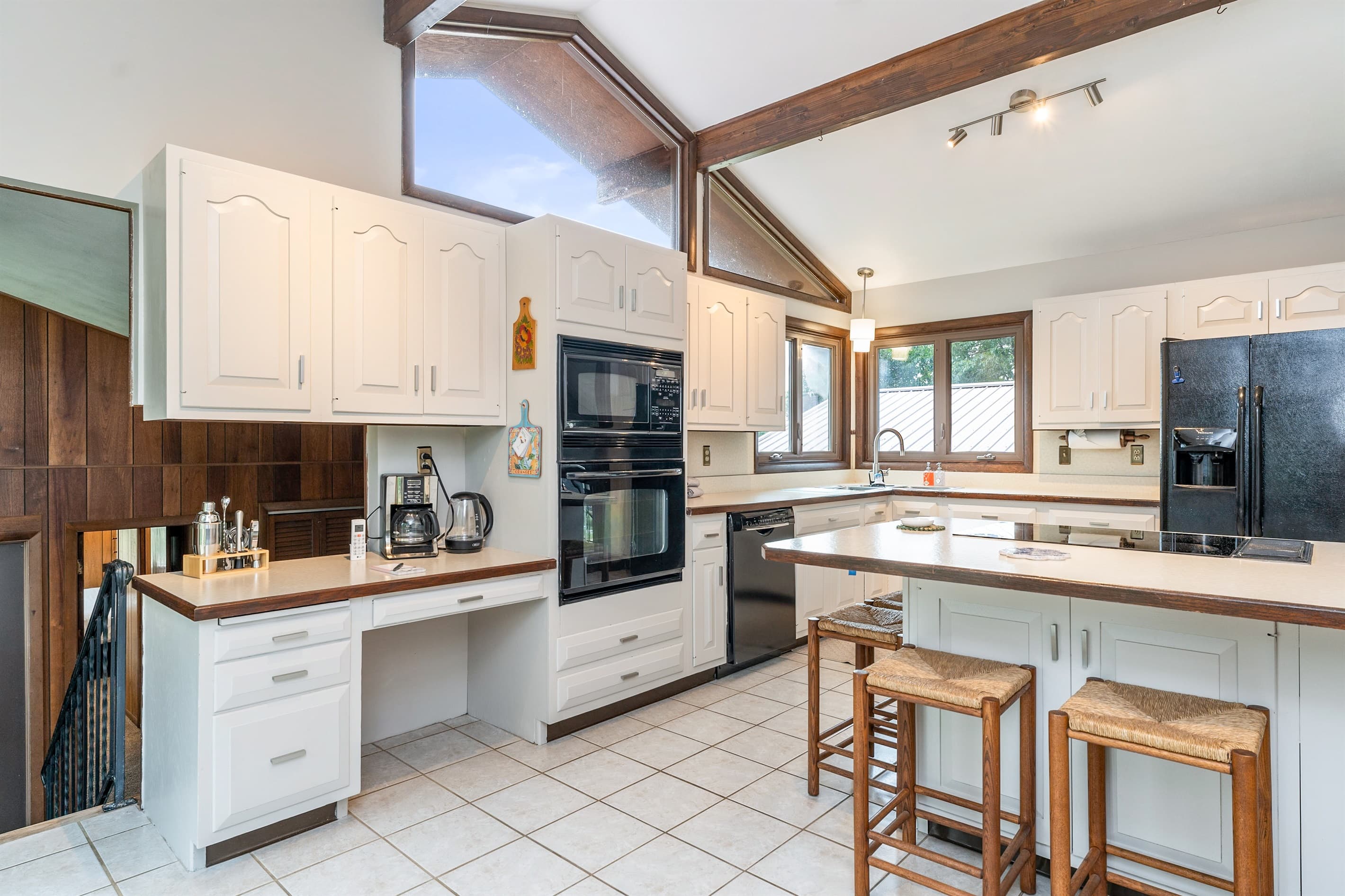 Open kitchen and dining area with vaulted ceiling