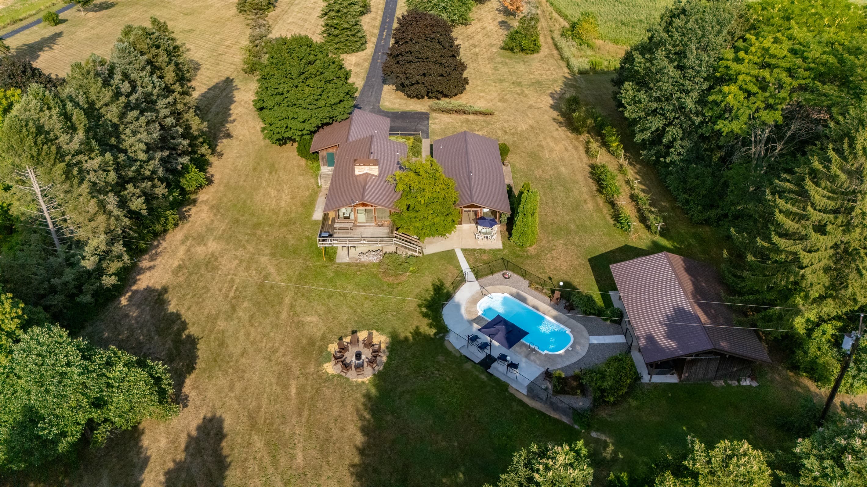 Property grounds with pool and fire pit