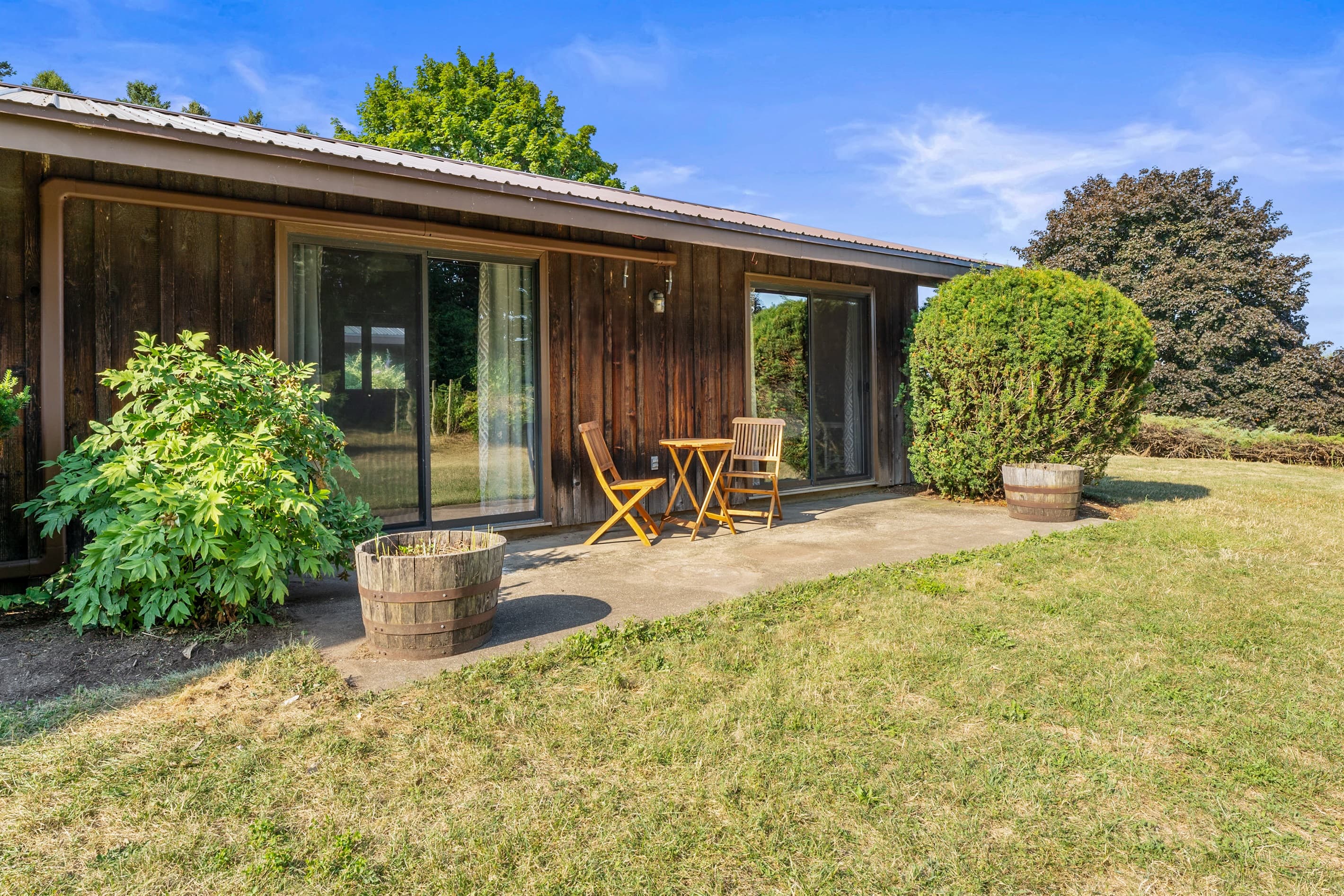 Patio seating beside sliding glass doors