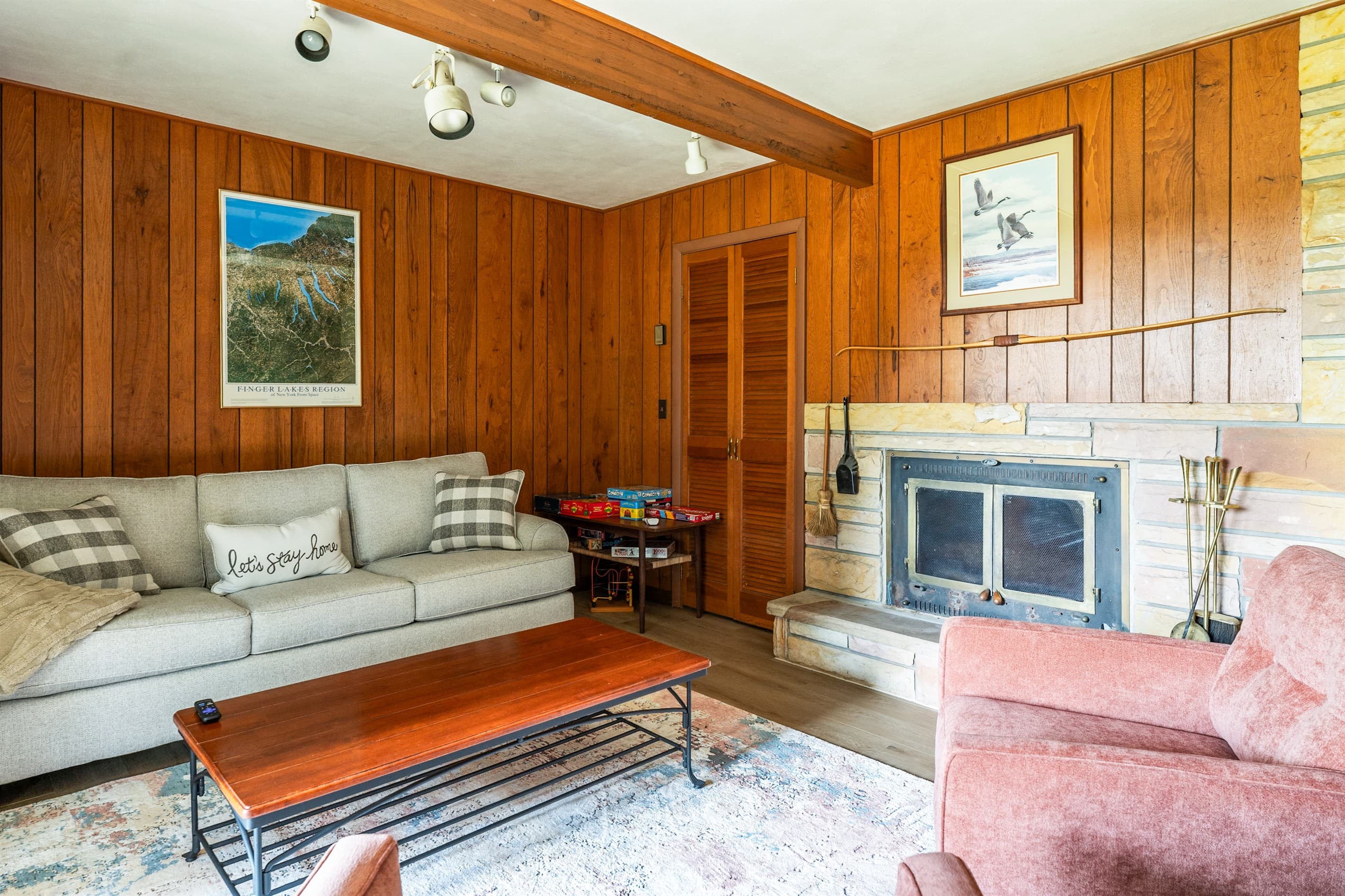 Sectional seating beside the stone fireplace