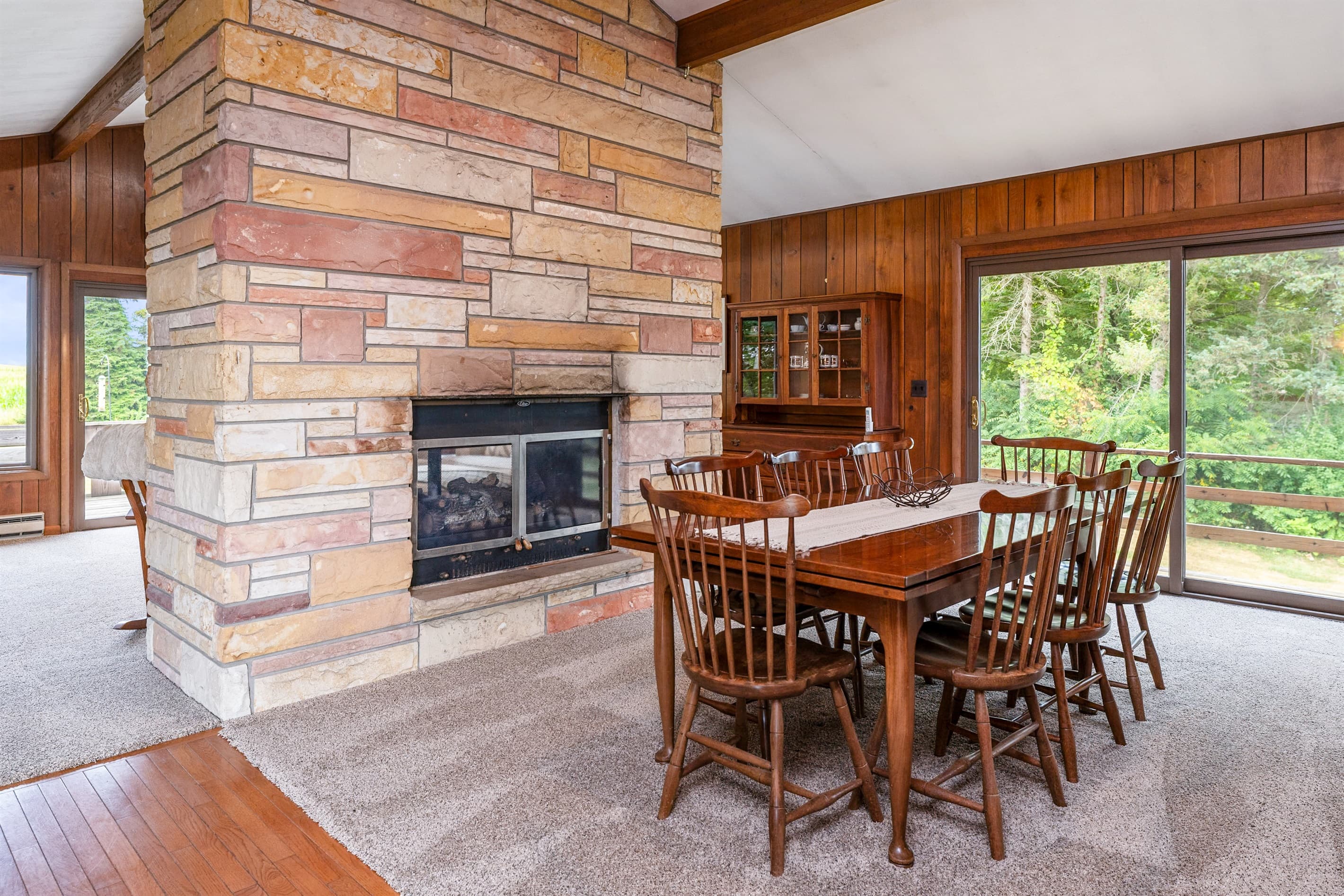 Dining table positioned near the fireplace