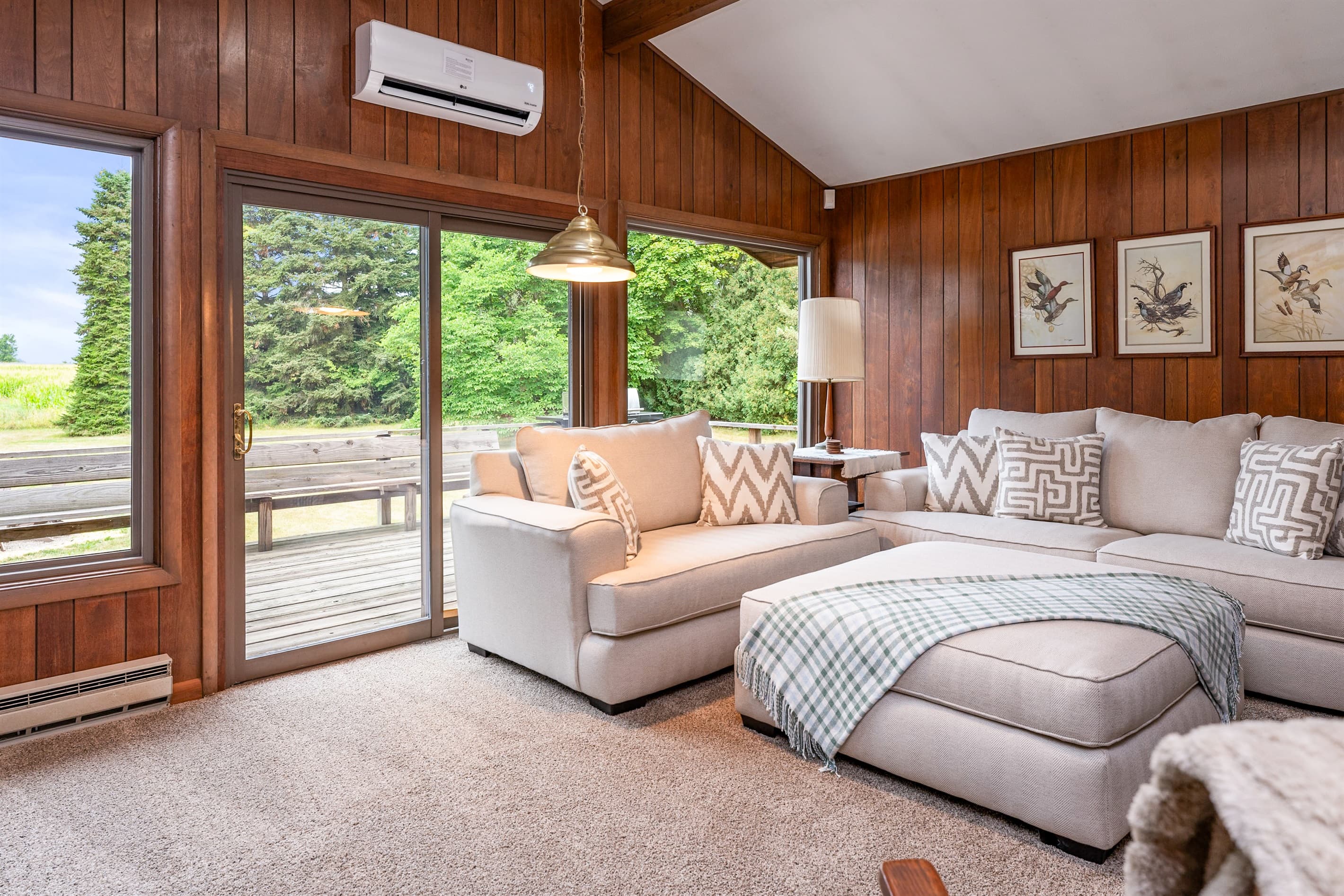 Living room with sectional and patio access