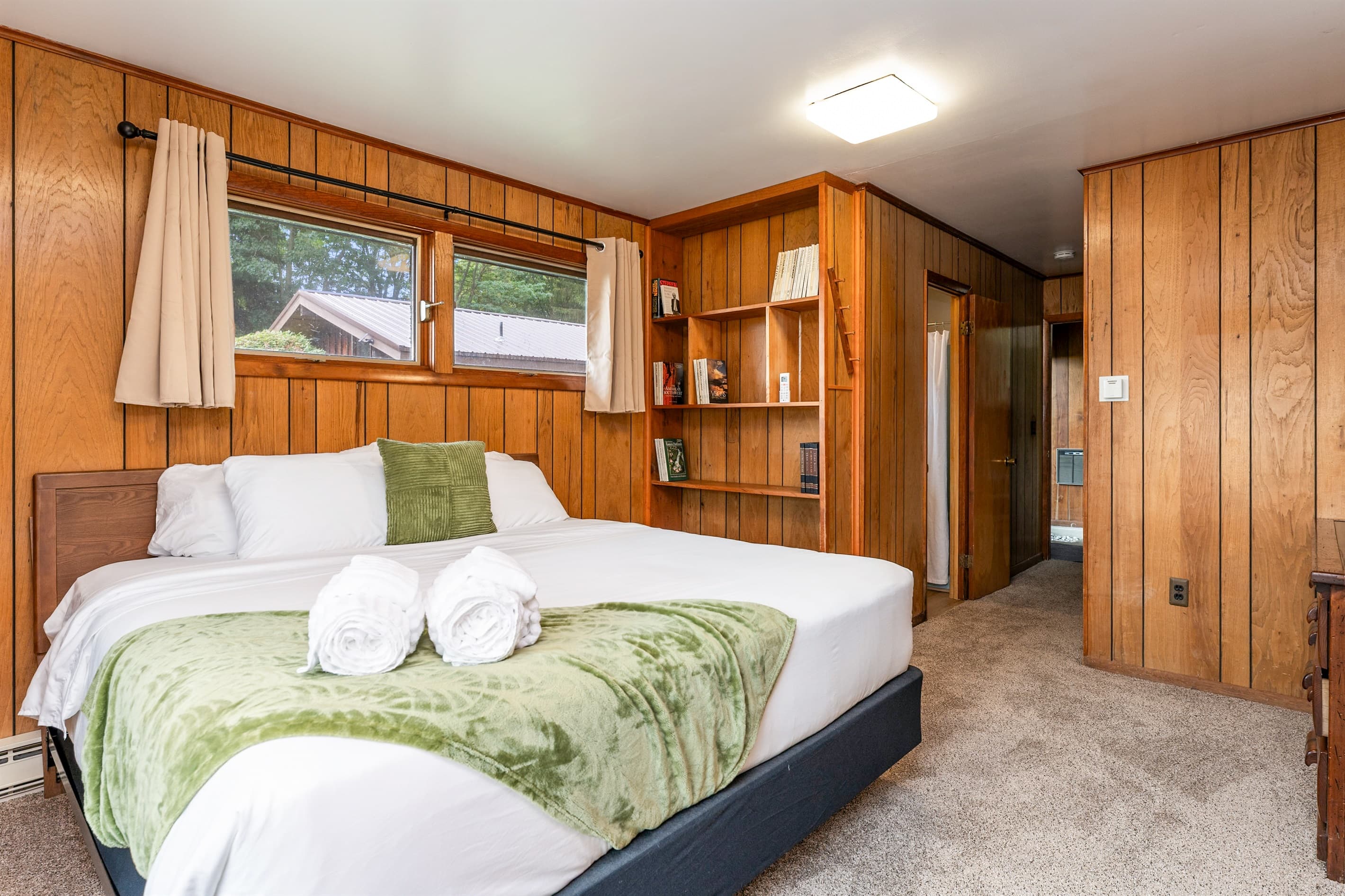 Wood-paneled bedroom with built-in storage