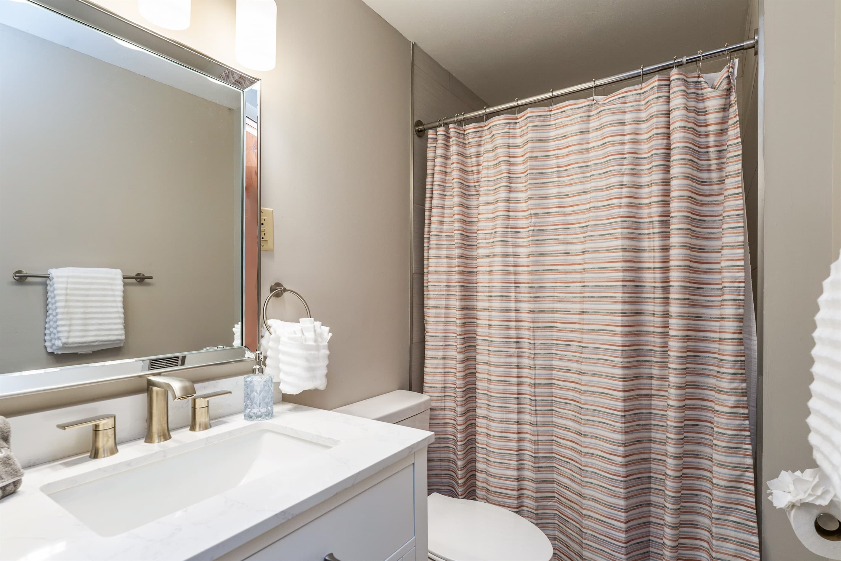 Full bathroom with toilet and shower