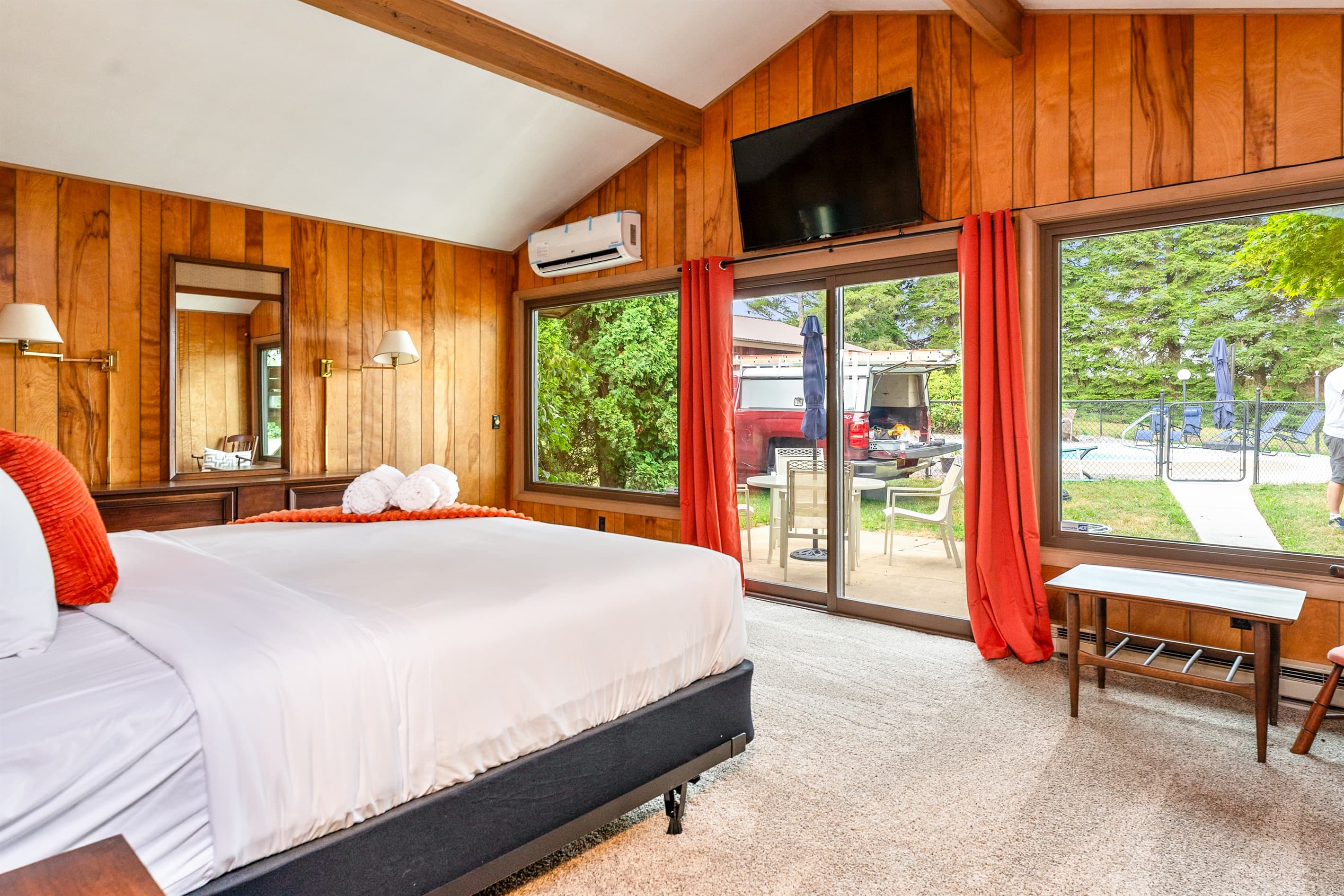 King bedroom with television and patio access