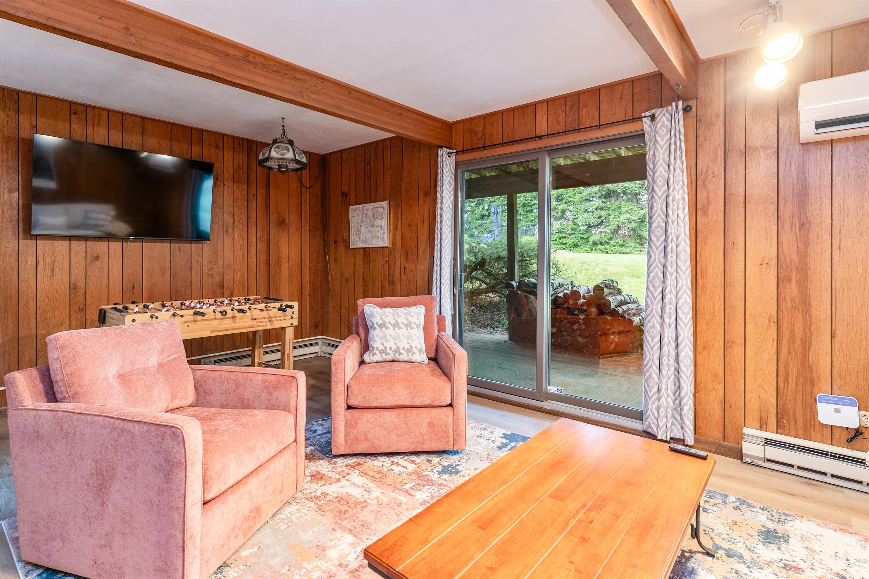 Family room with coffee table and outdoor access