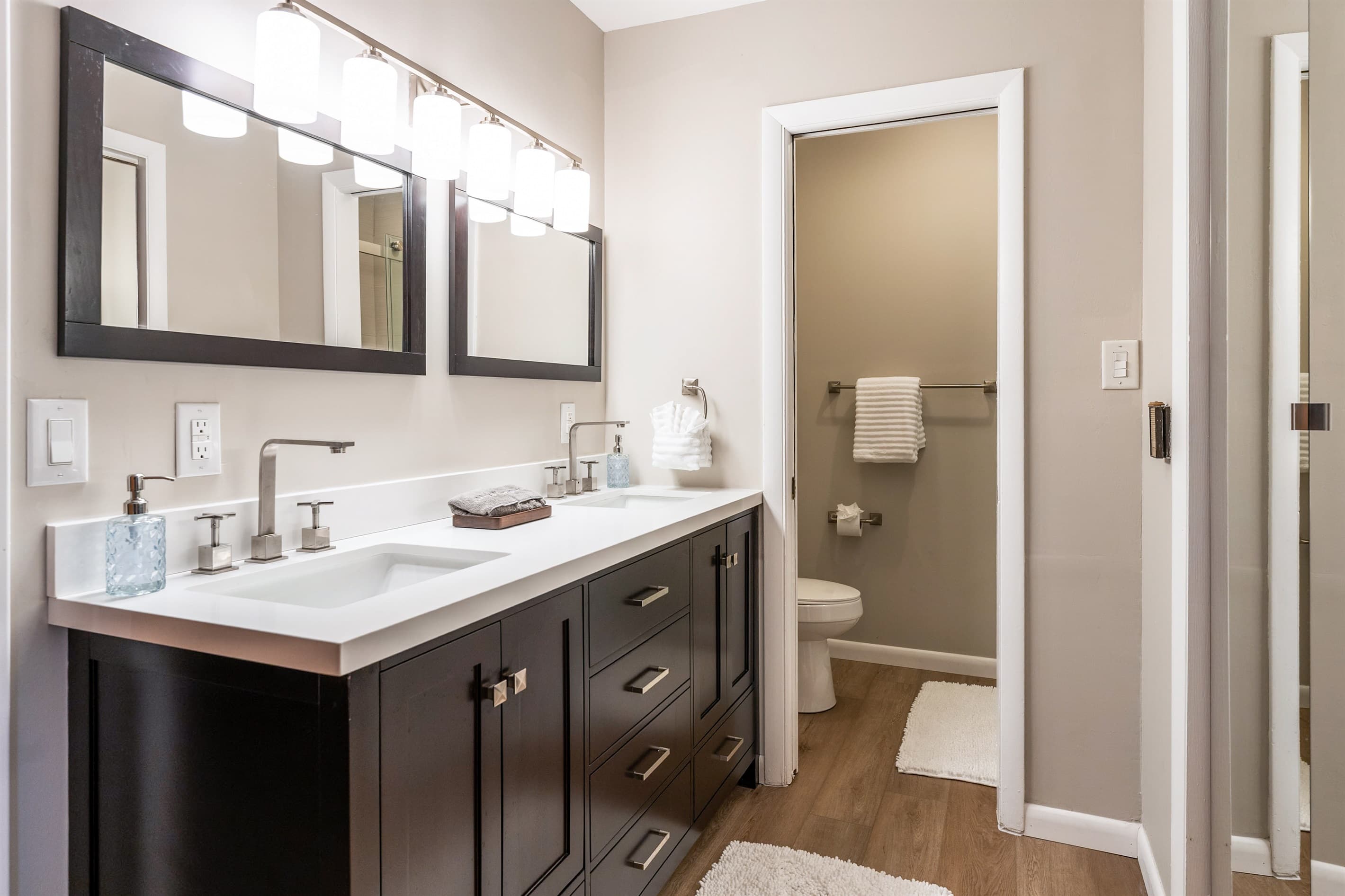 Double-vanity bathroom with private toilet 