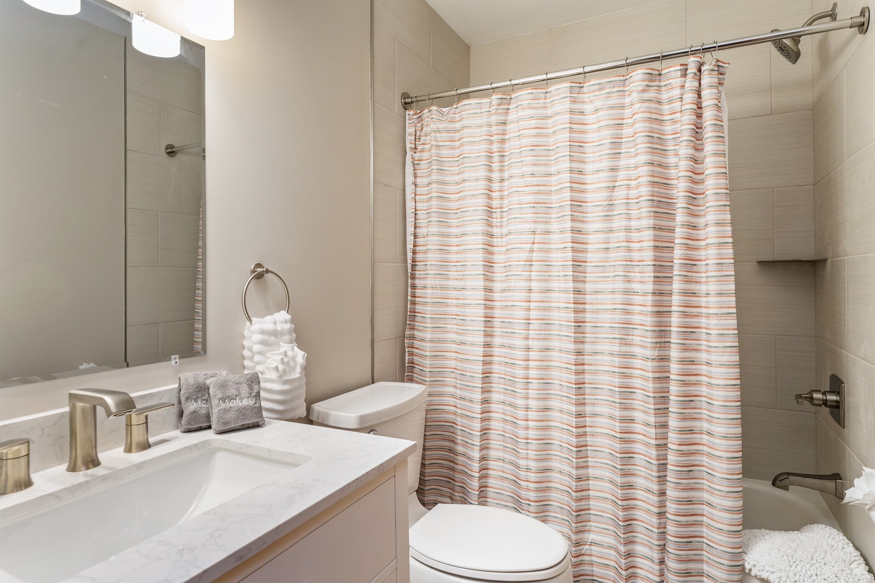 Bathroom with pedestal sink and shower curtain