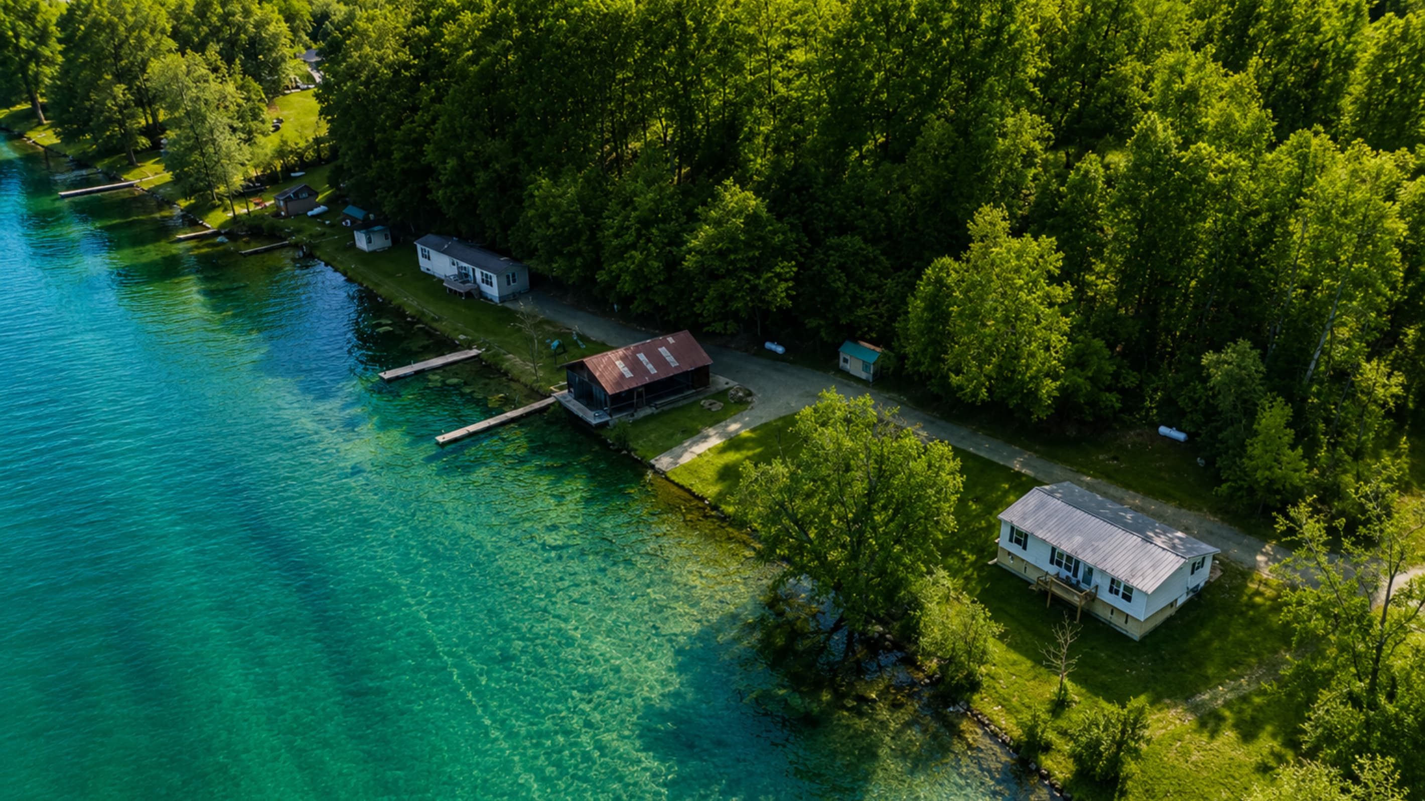 Aerial view of cabins along the shoreline
