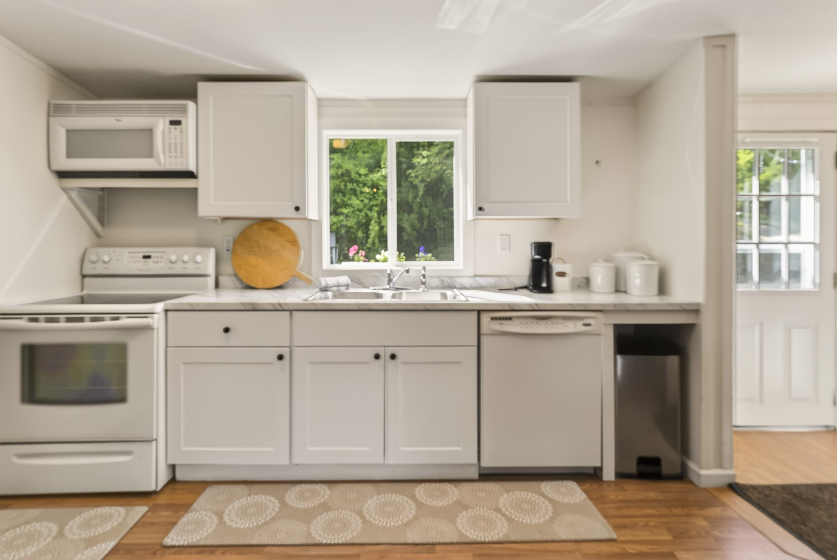 Cabin #1 kitchen with white cabinetry