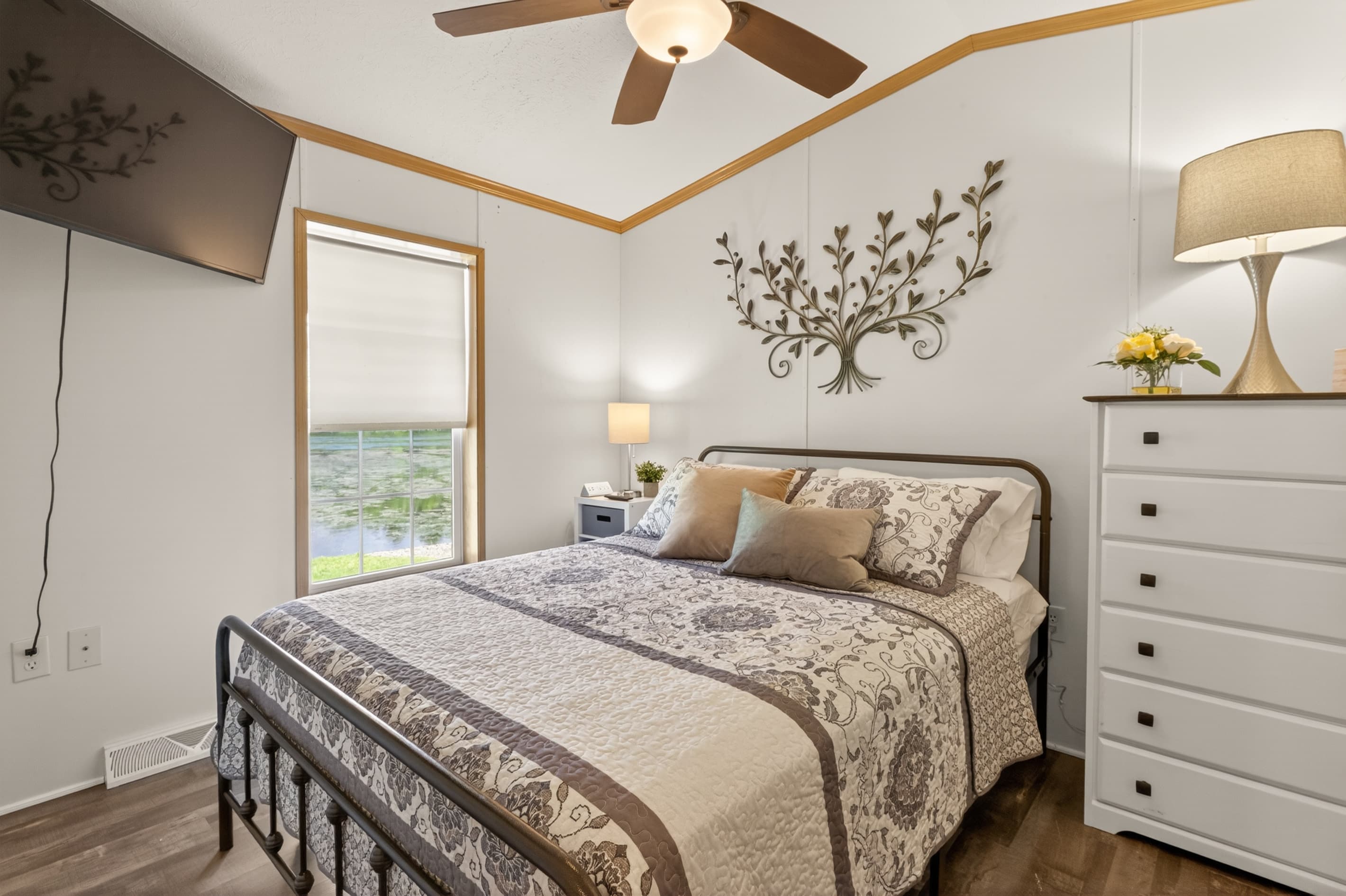 Cabin #2 bedroom with smart TV and a white dresser
