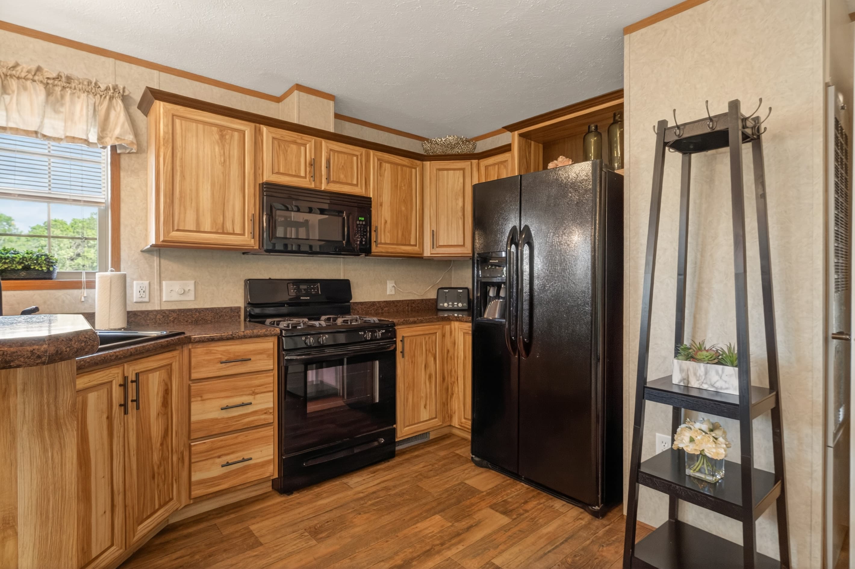 Cabin #3 kitchen with black appliances