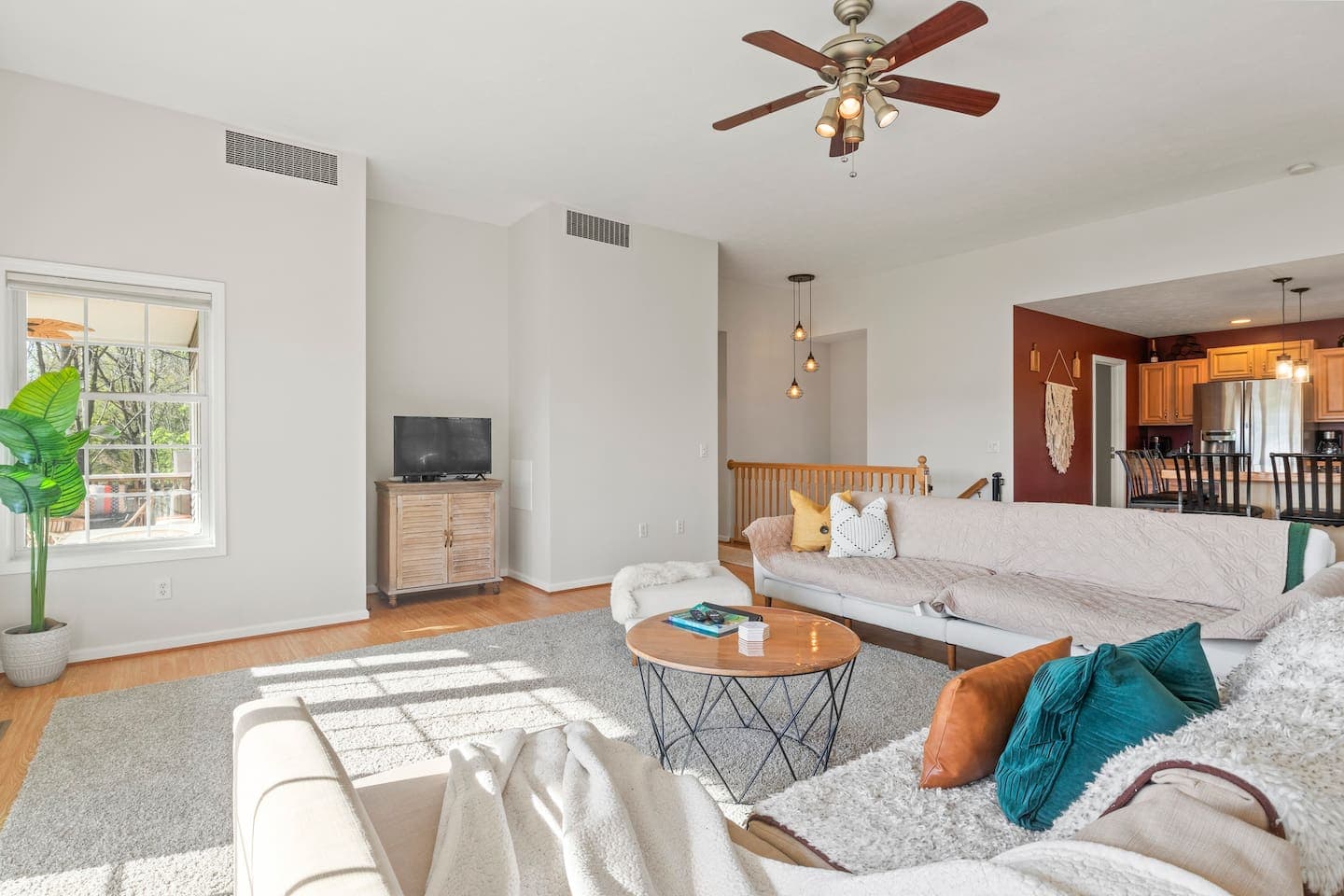 Open living area with ceiling fan 