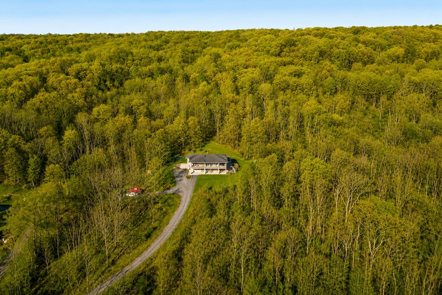 Aerial view of the secluded wooded property