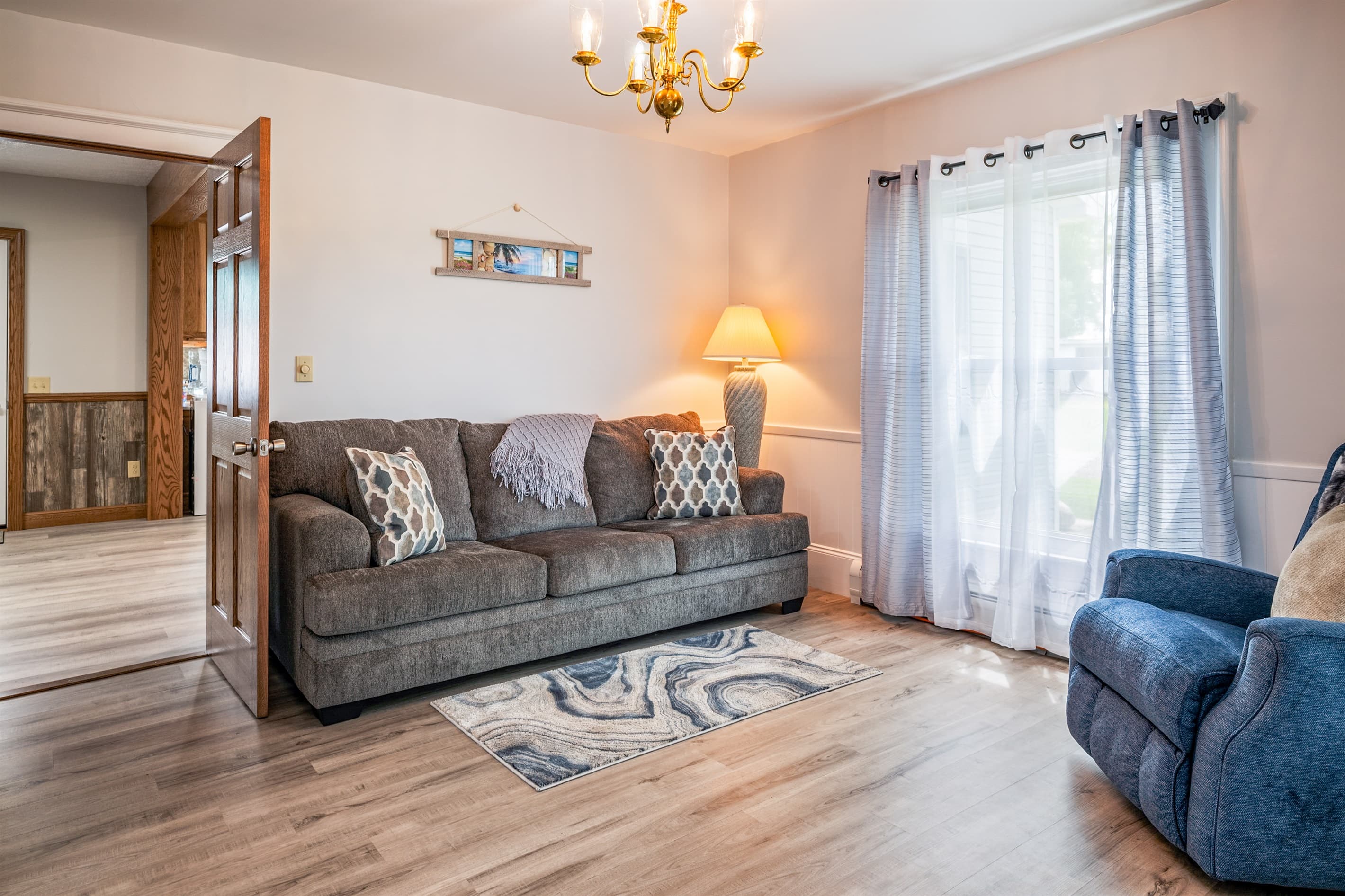 Living room with sectional and blue armchair