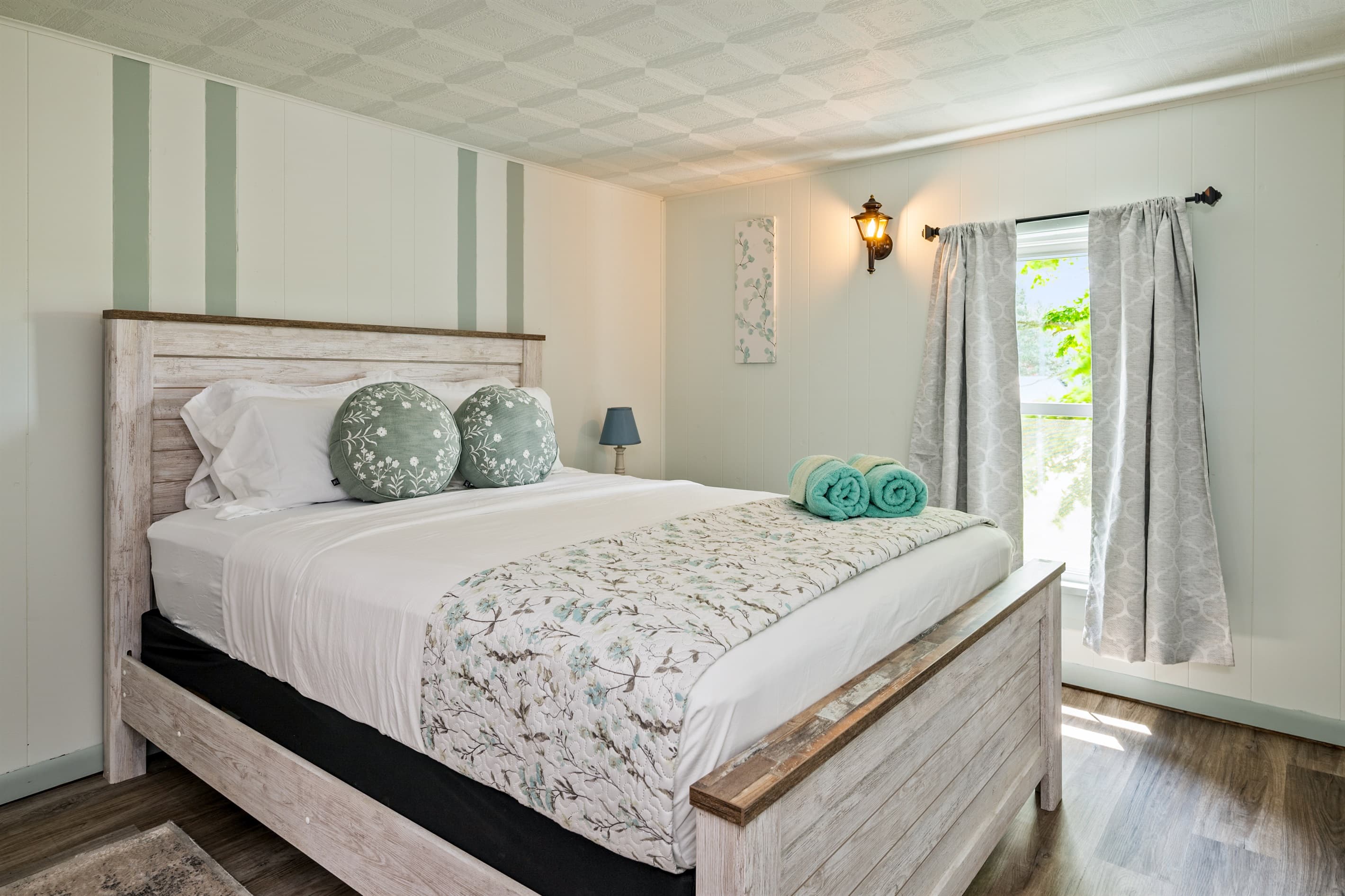 Bedroom with upholstered bed and soft lighting