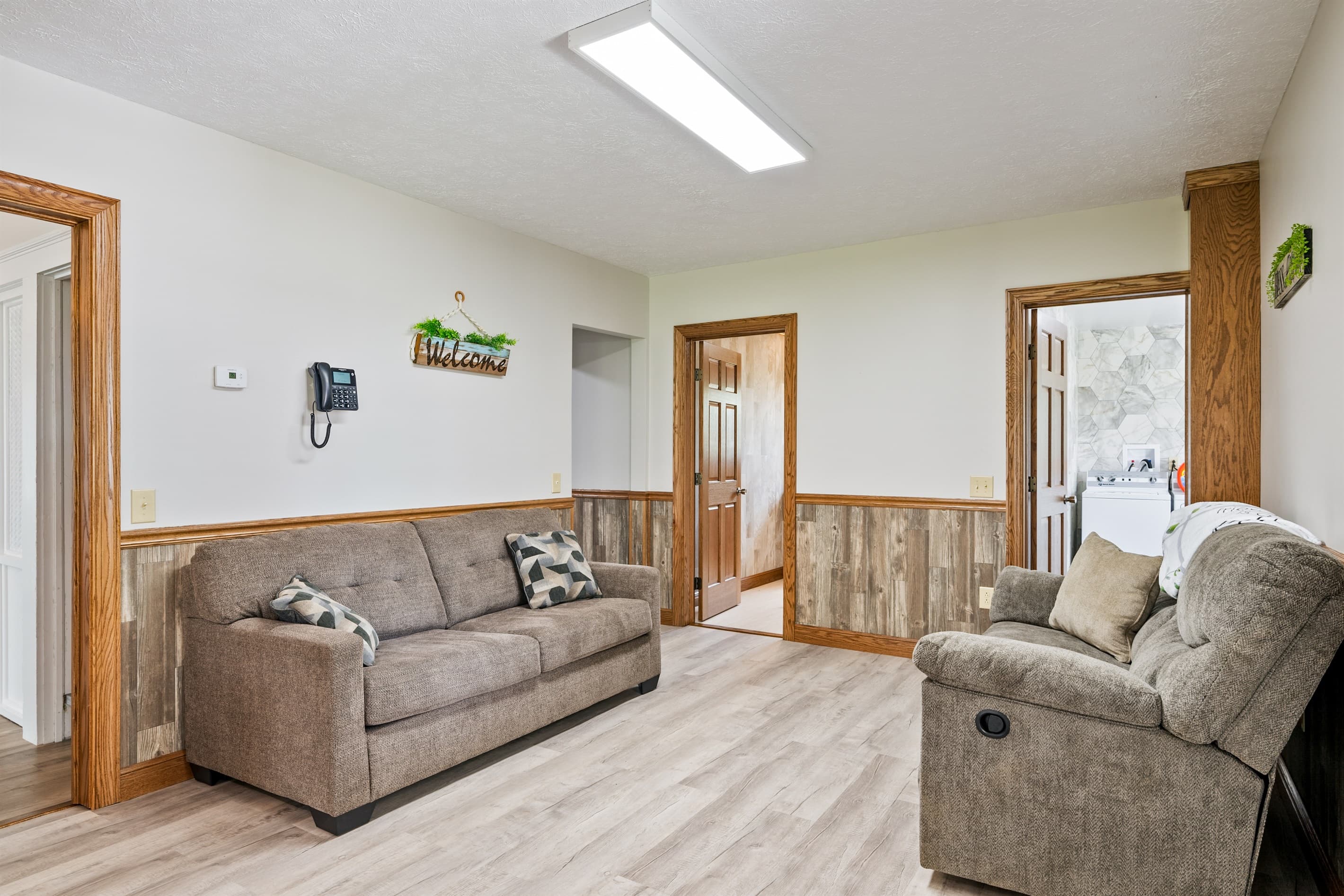 Open living area beneath a bright ceiling