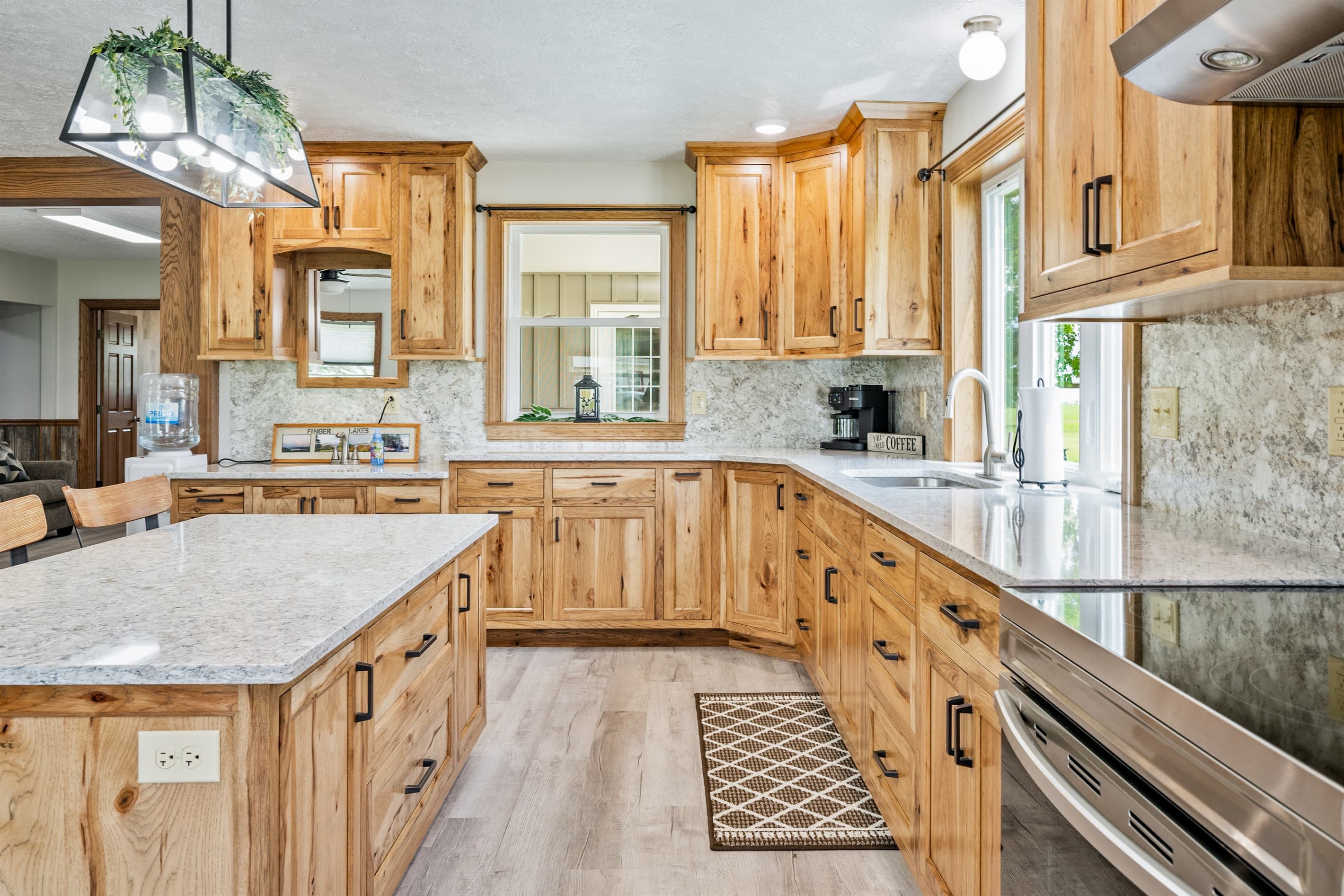 Wood kitchen with island and pendant lights