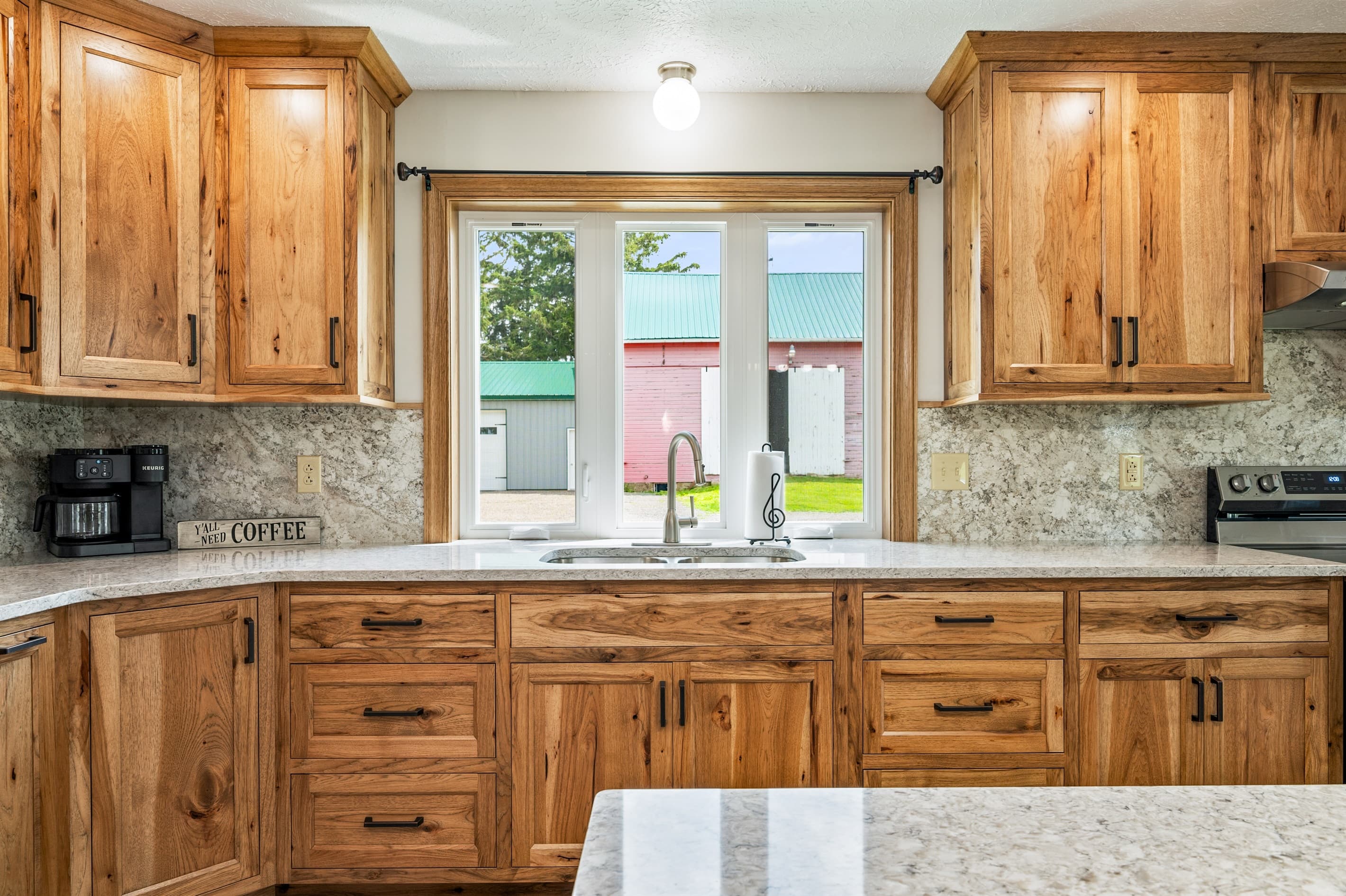 Kitchen sink beneath a large window