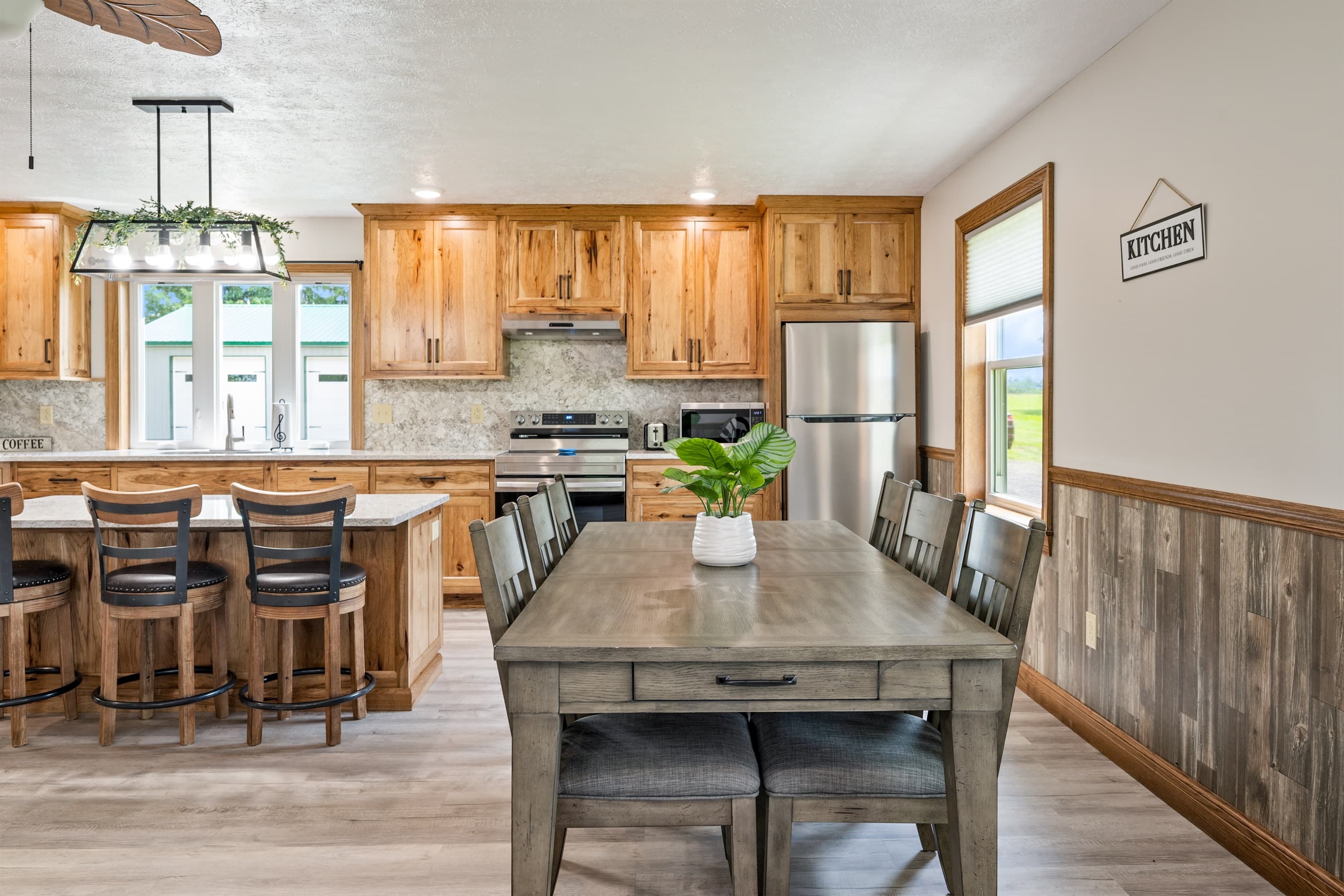 Dining table positioned beside the kitchen
