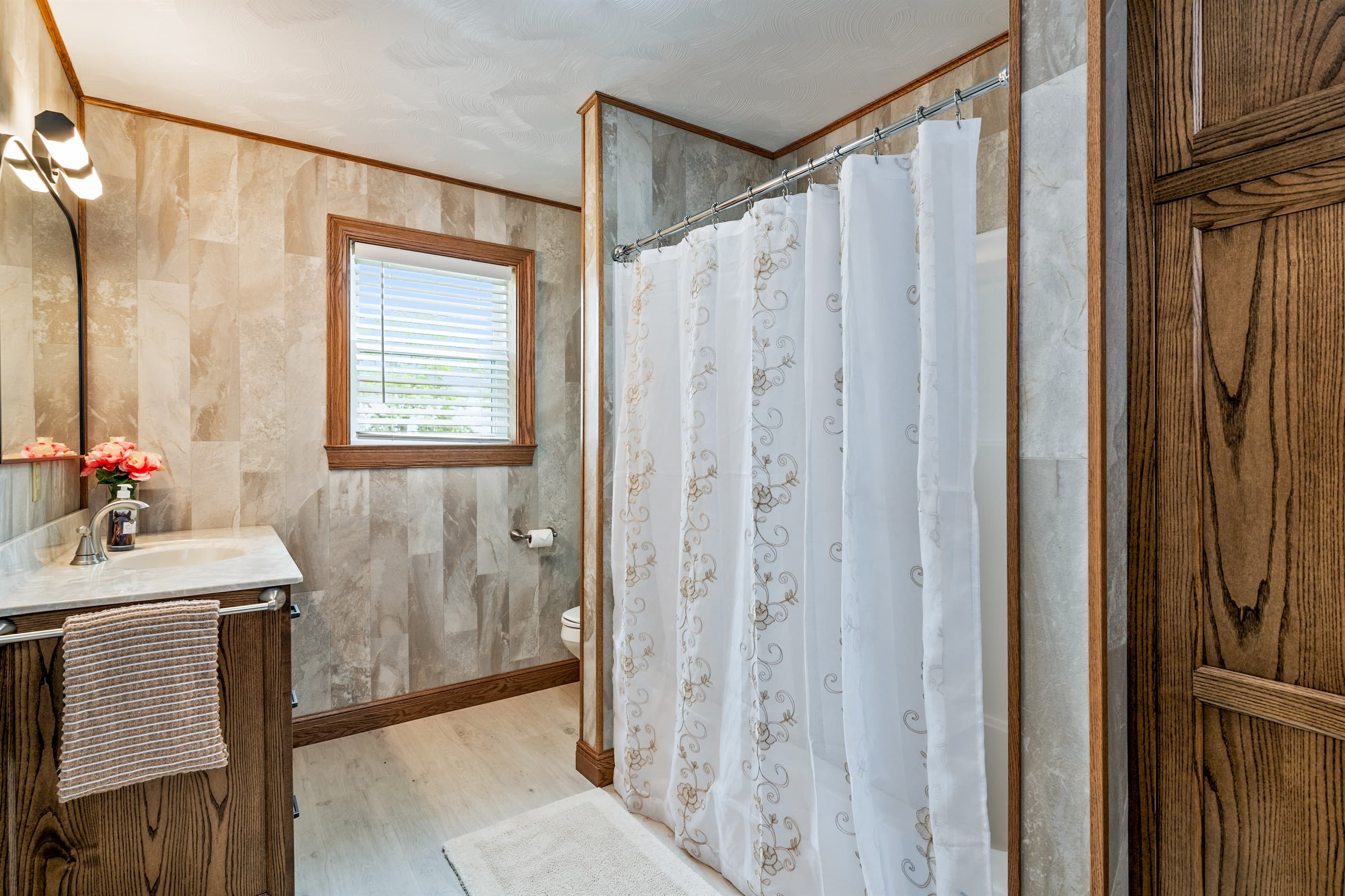 Full bathroom with enclosed shower