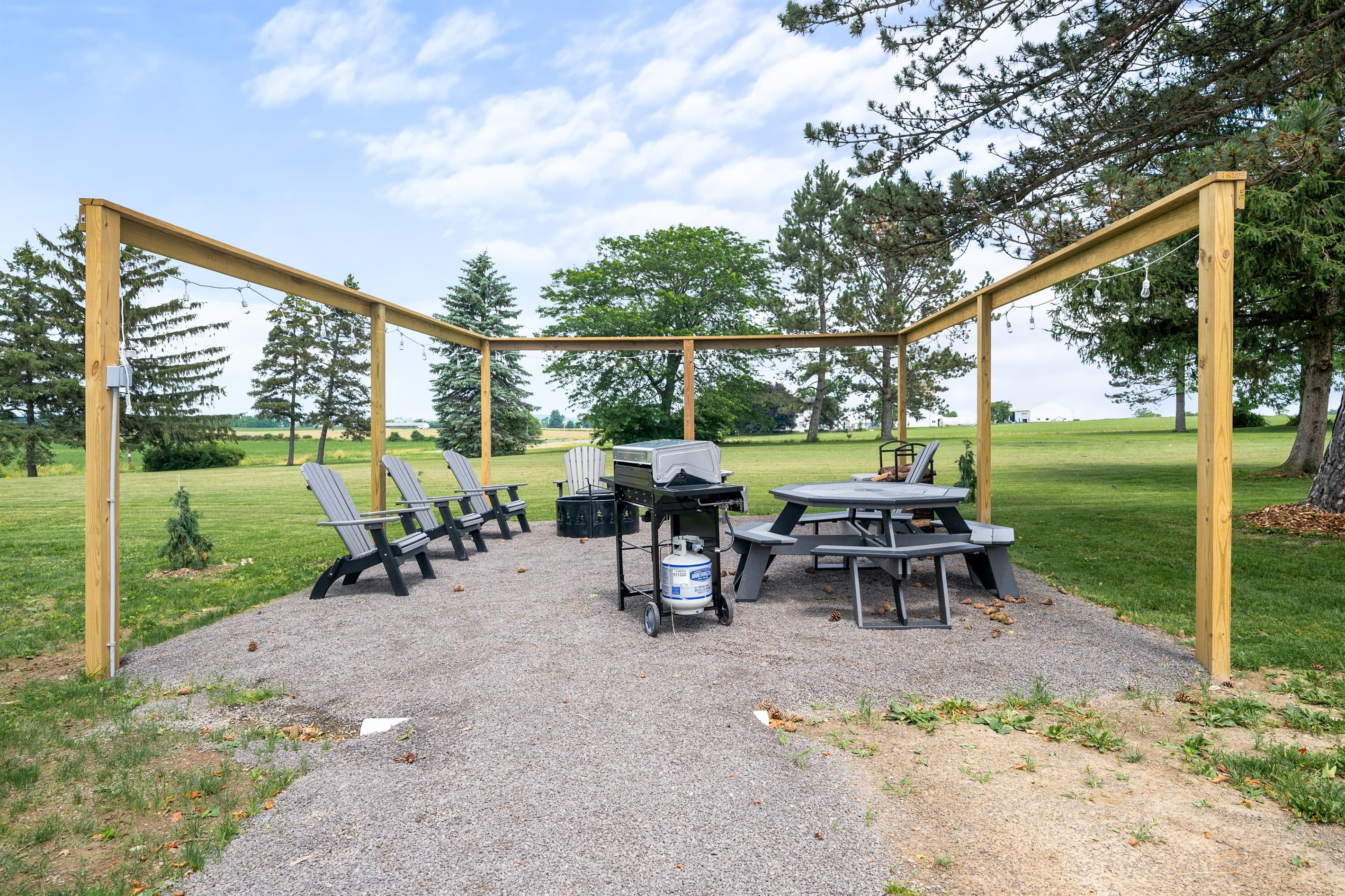 Patio dining area beneath wooden pergola