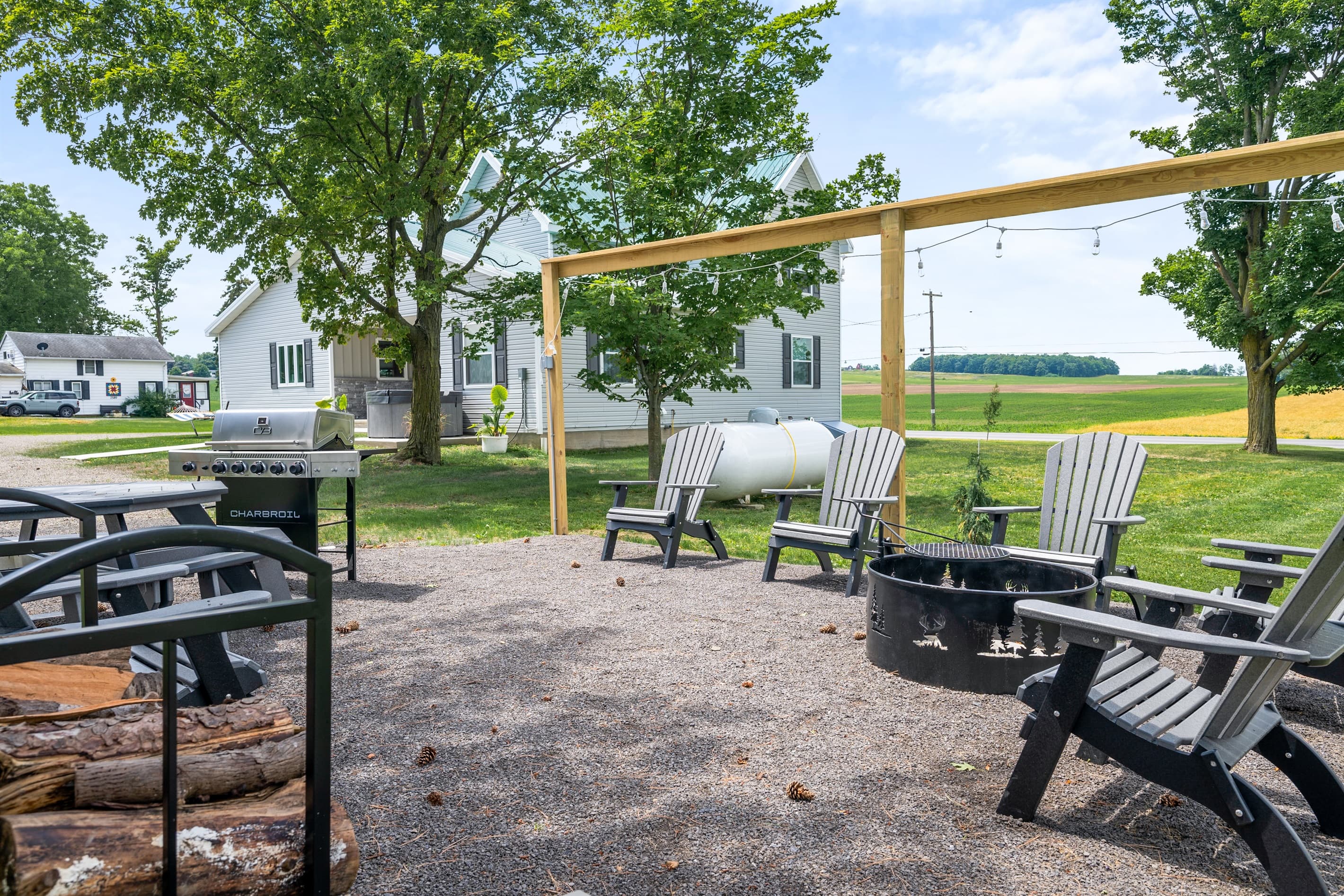 Grill and dining space beside the lawn