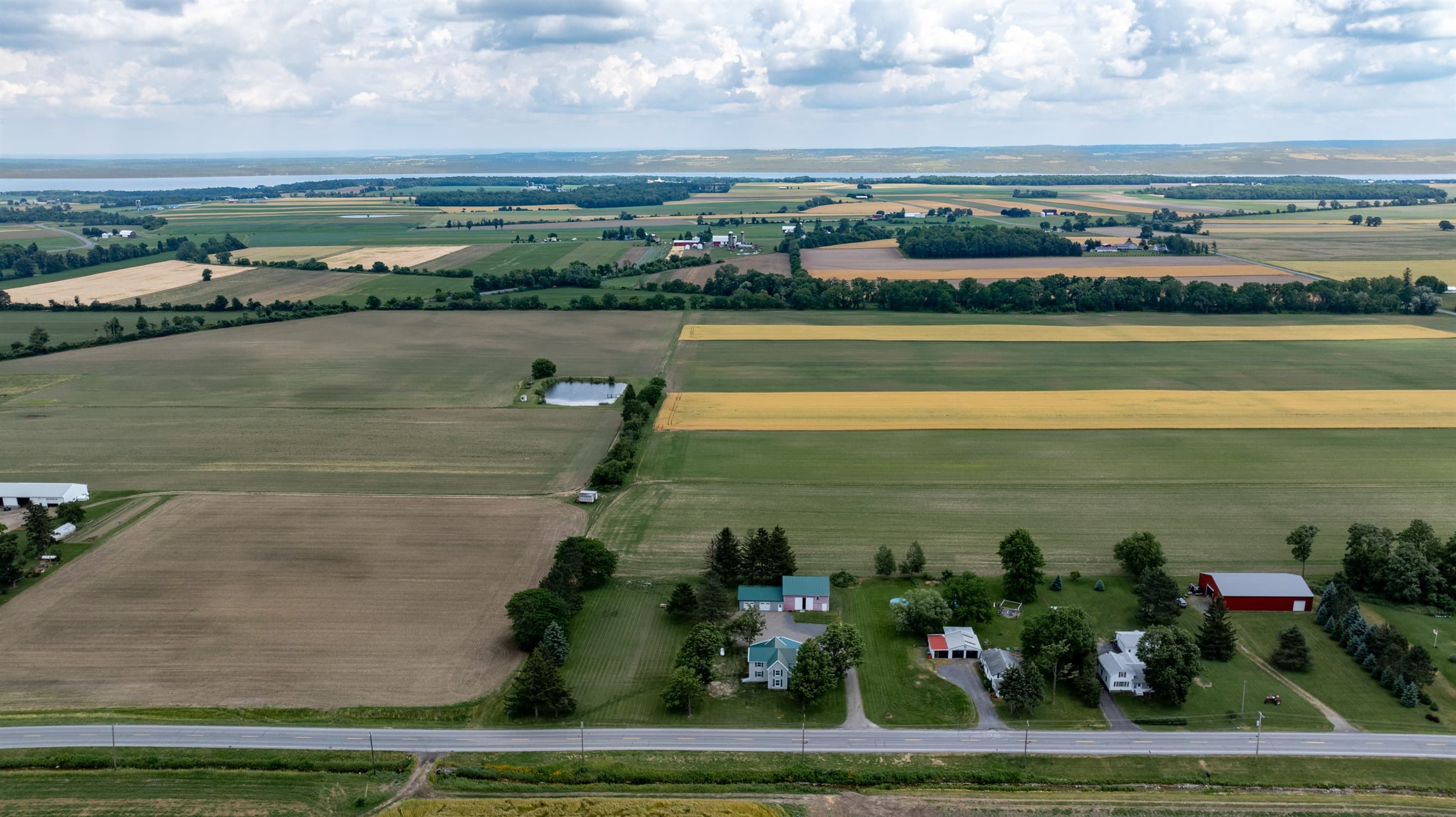Wide landscape of fields beyond the property