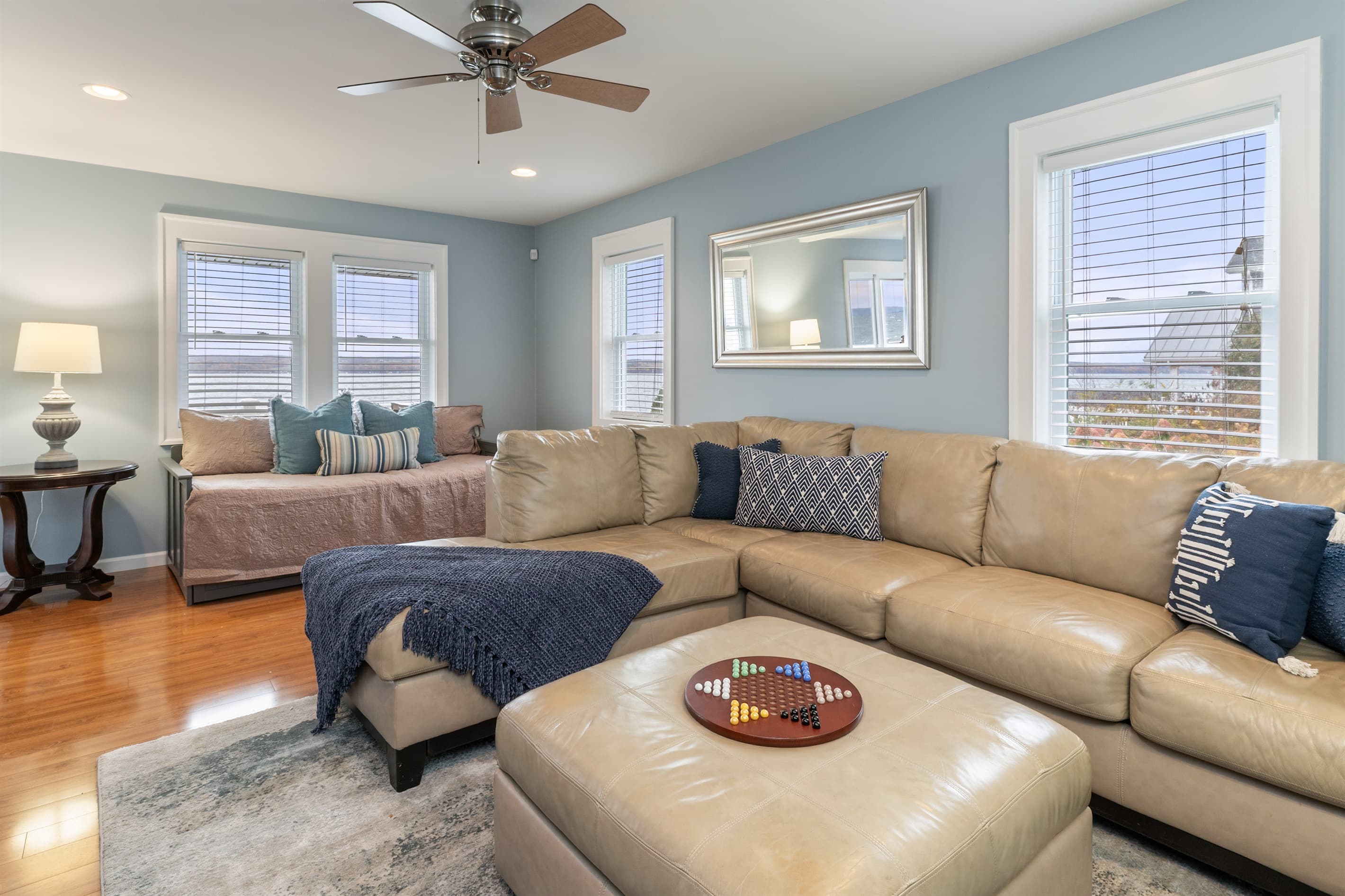 Living room with sectional and ceiling fan