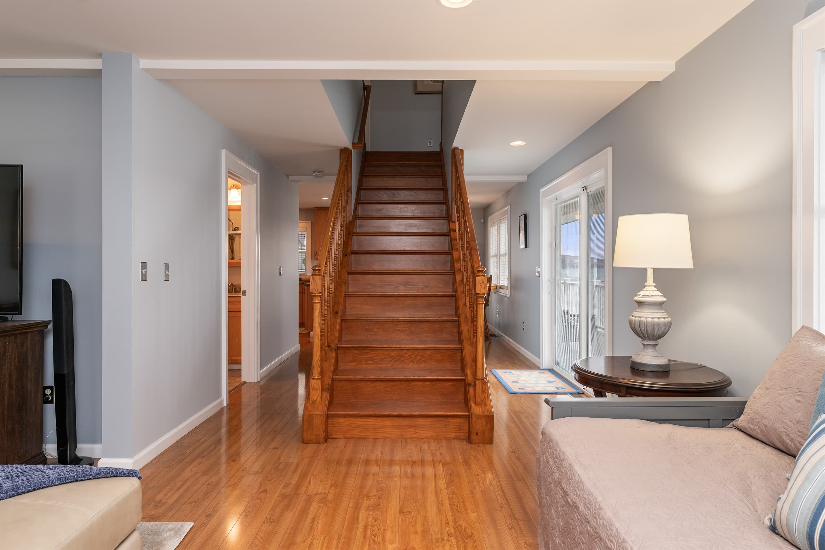 Wooden staircase connecting both levels