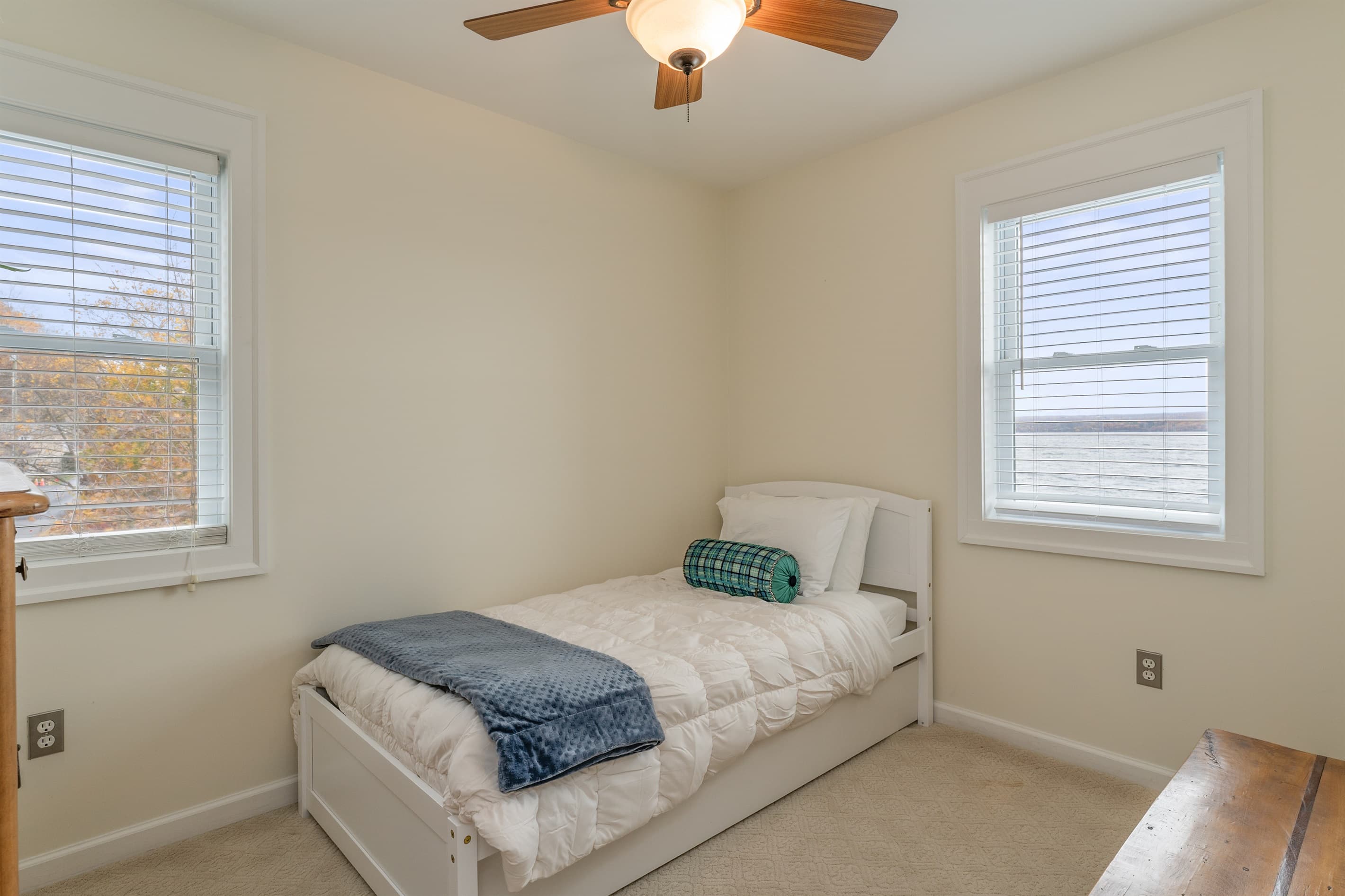 Twin trundle bedroom with ceiling fan