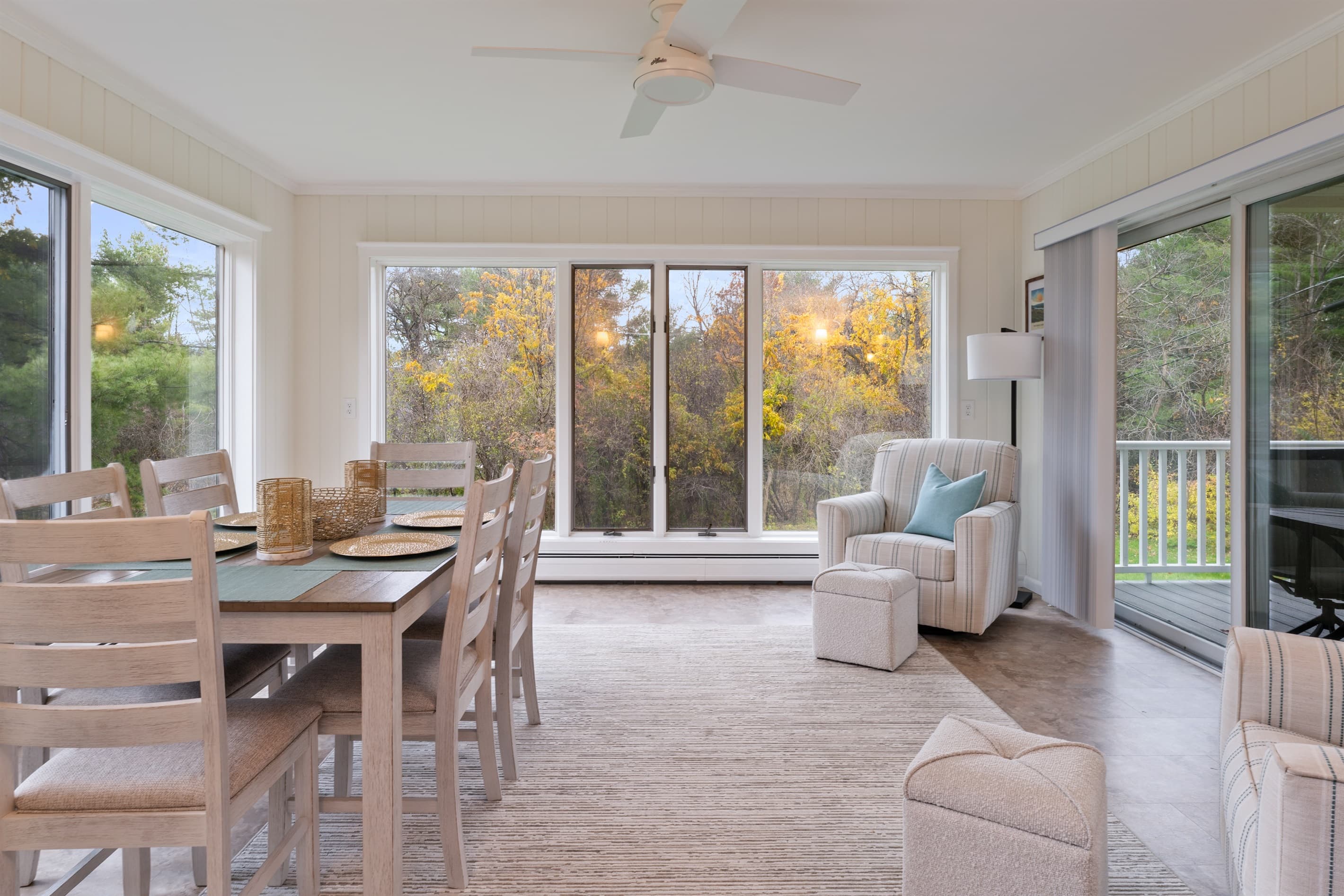 Sunroom dining area with outdoor views