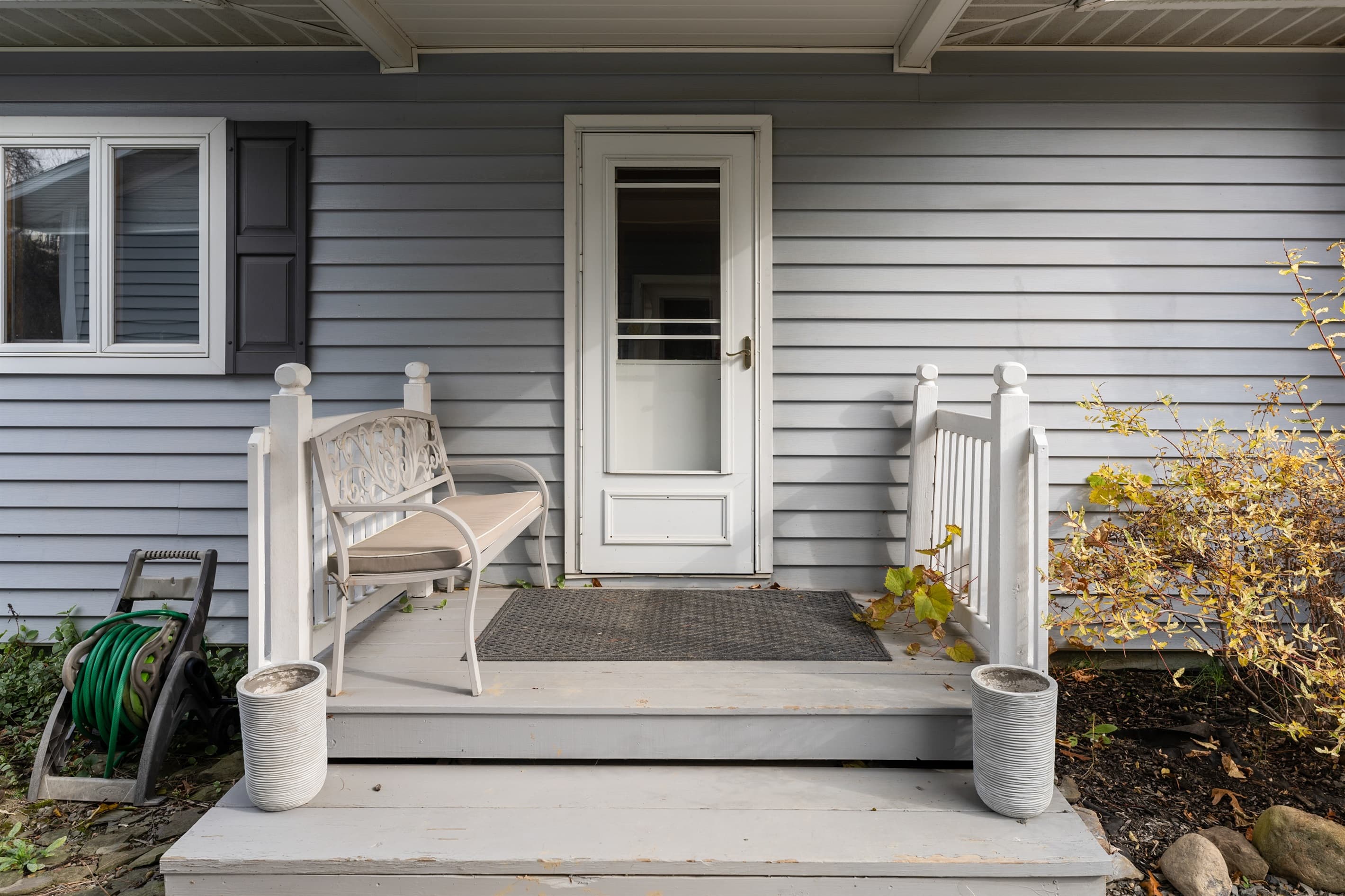 Covered entry with porch seating