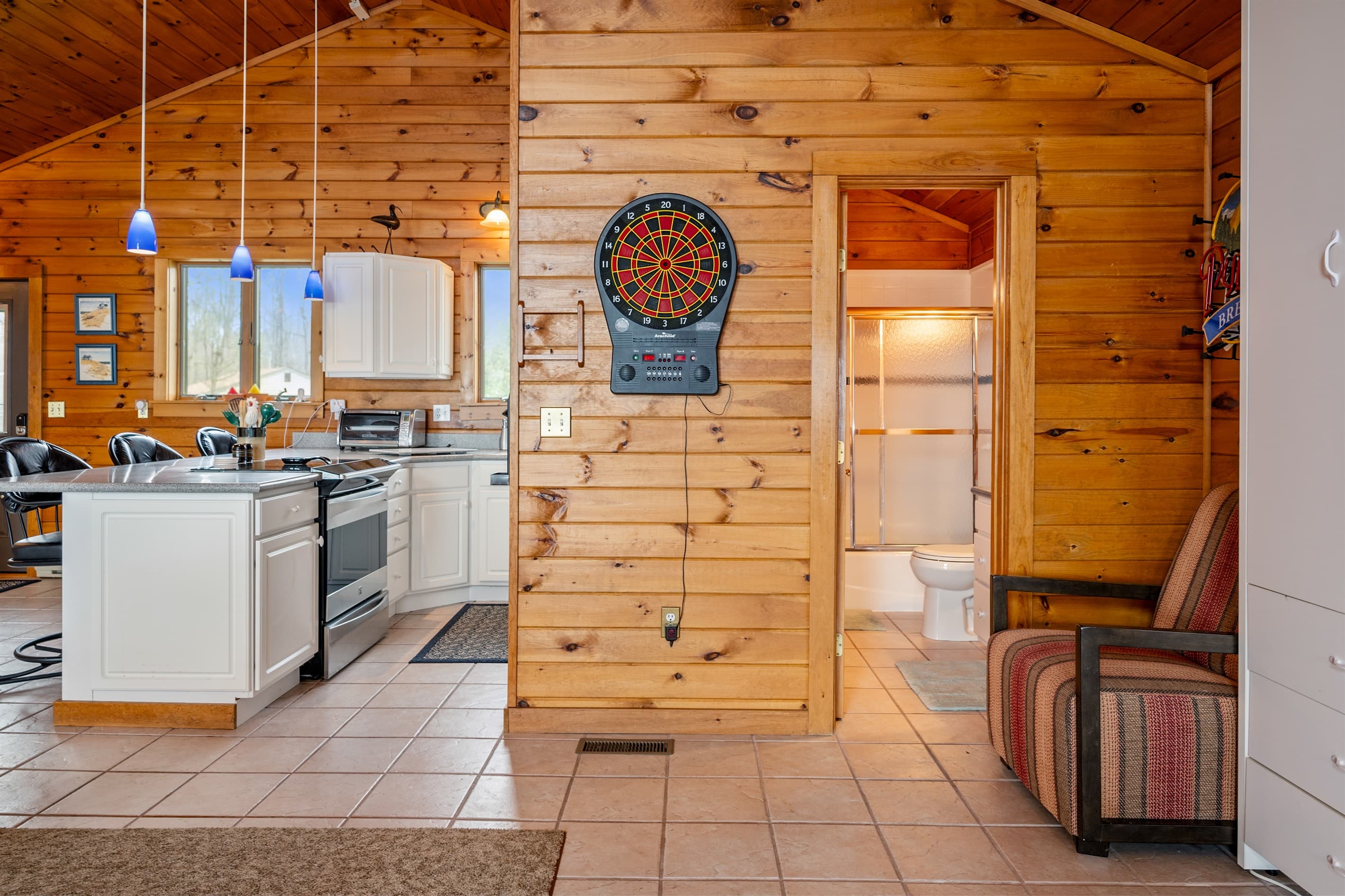 Kitchen and dining area with dartboard
