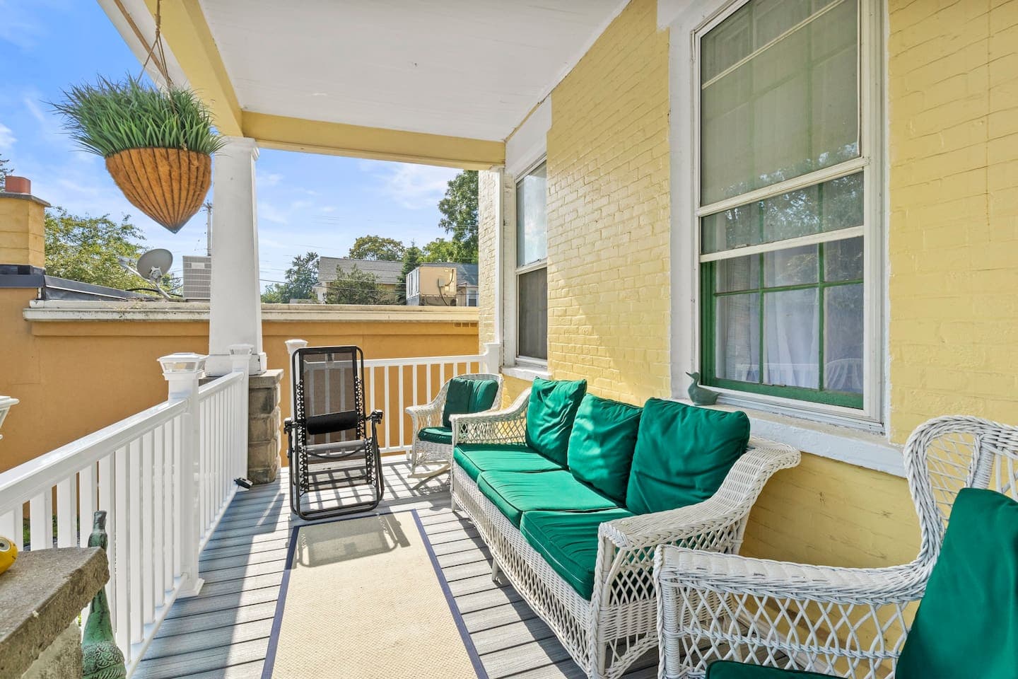 Front porch with cushioned bench seating