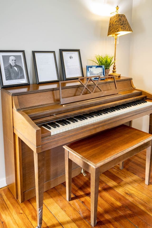 Upright piano with matching wooden bench
