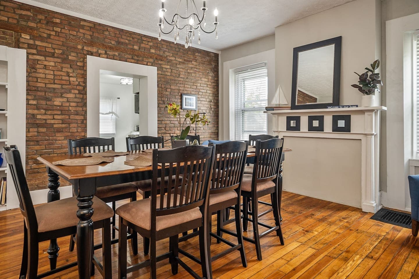 Dining room with fireplace and brick wall