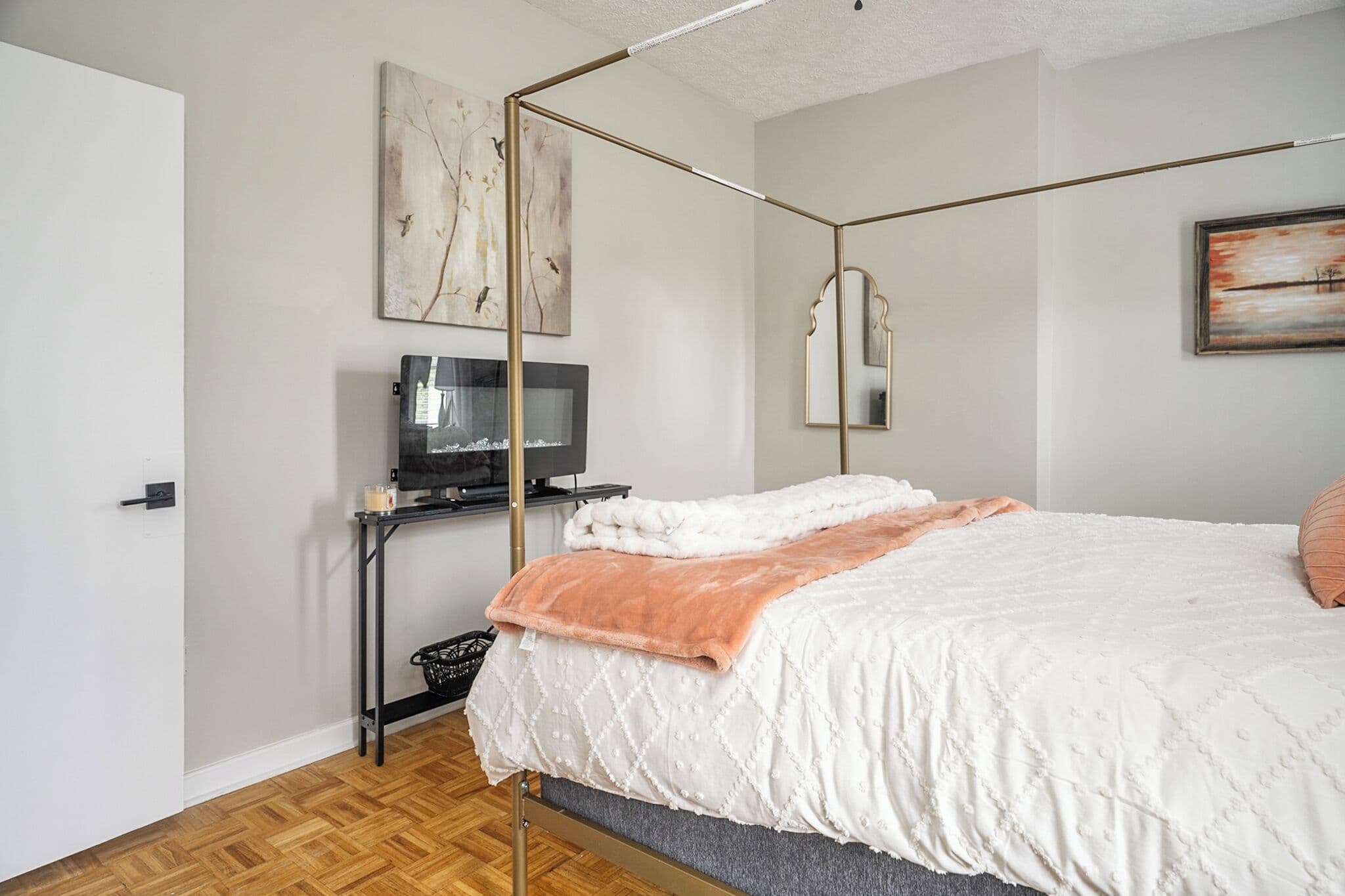 Canopy bedroom with fireplace and natural light