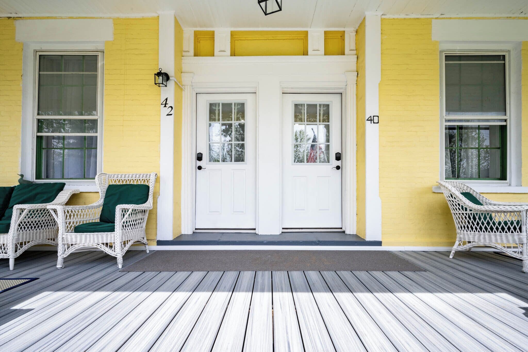 Covered main entrance with porch seating