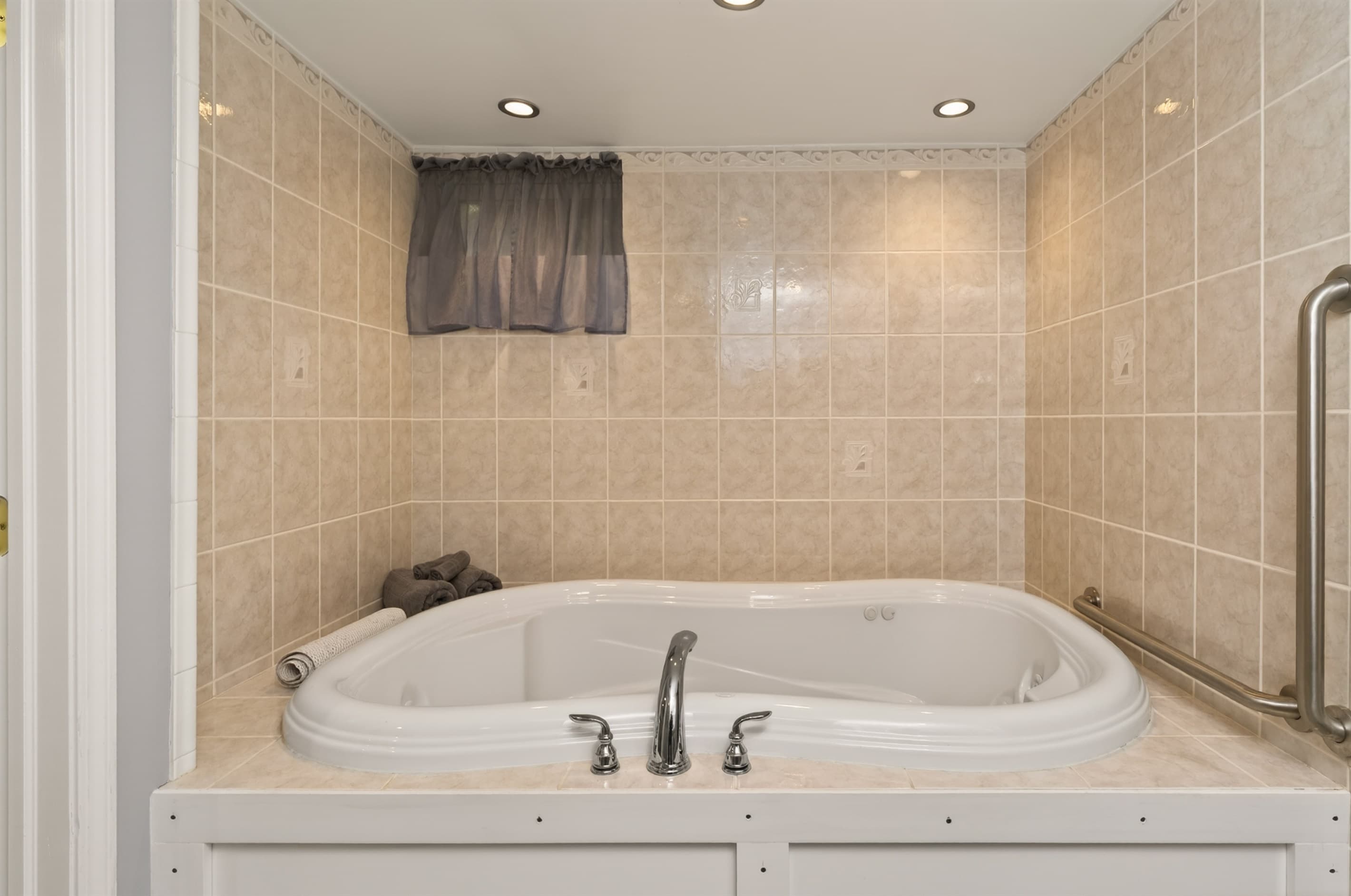 Bathroom with jetted bathtub 