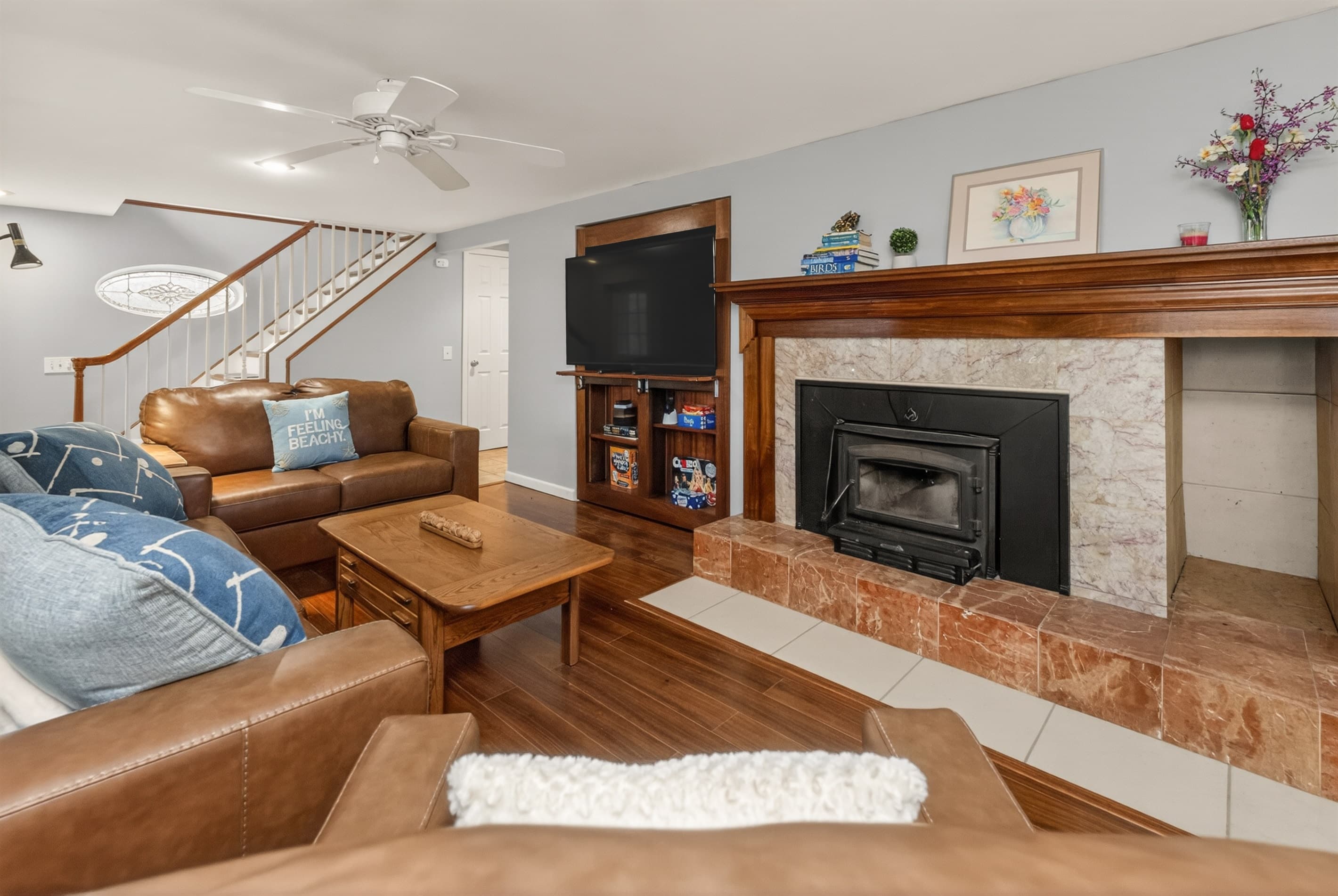 Leather seating arranged around the fireplace