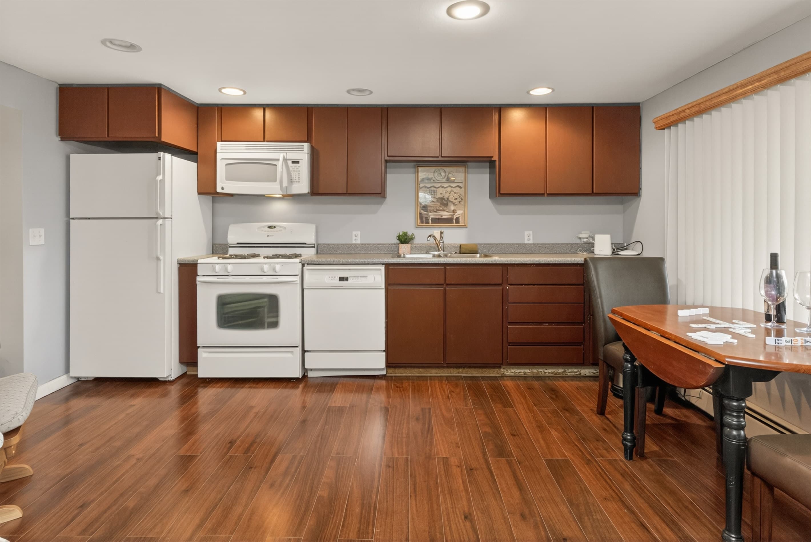 Kitchen with dark wood cabinetry and island