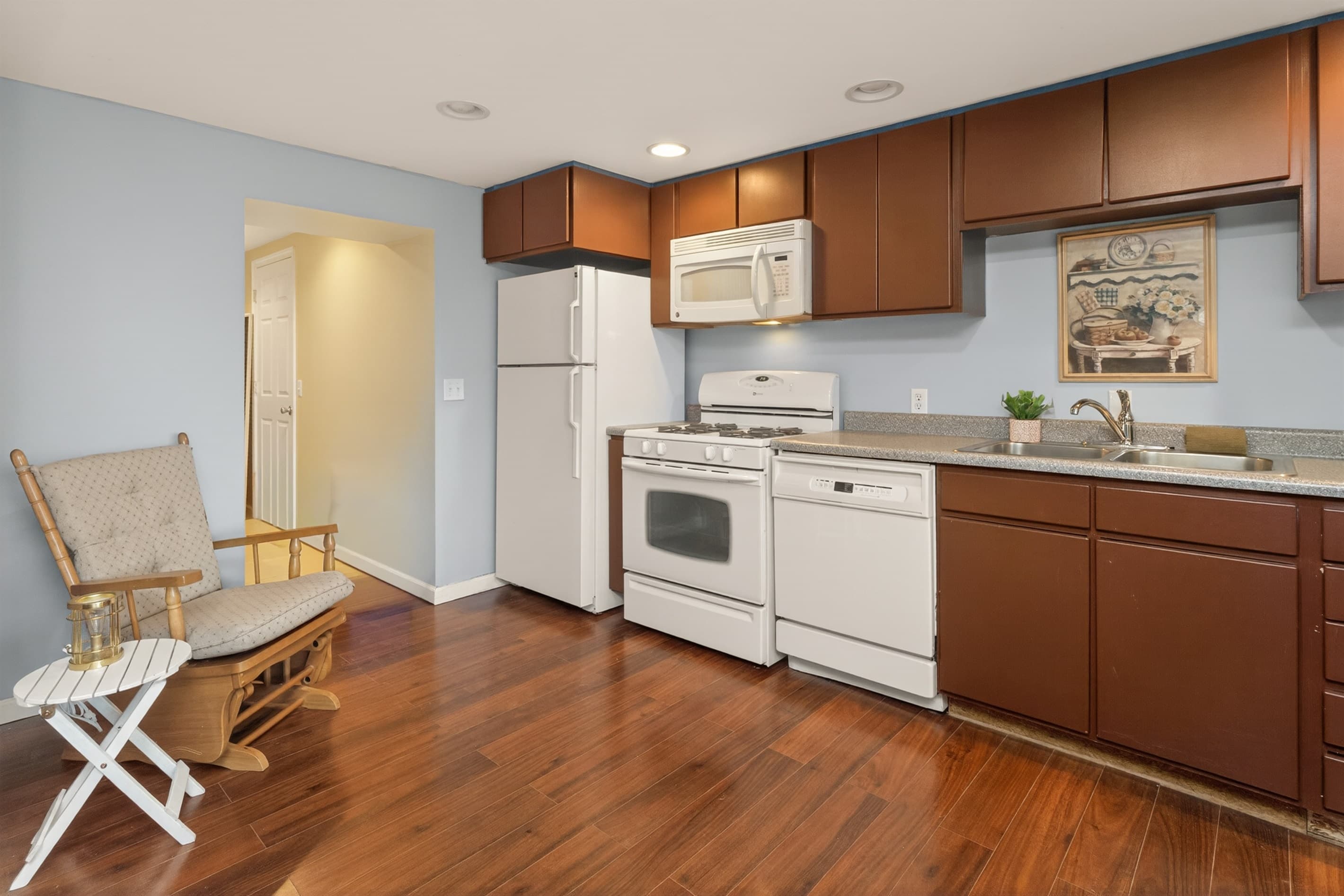 Galley kitchen with stainless steel appliances