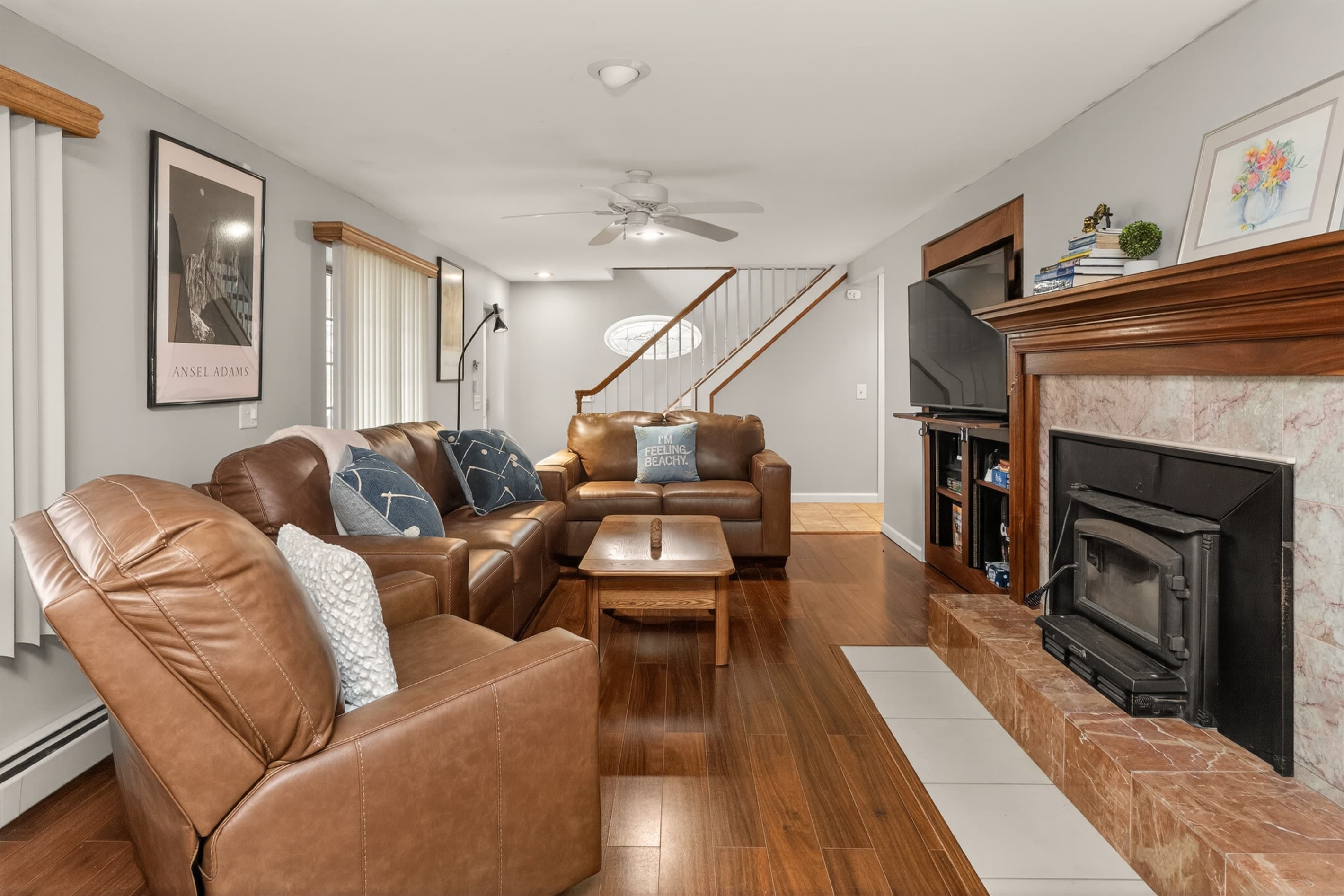Living room with leather sofa and armchairs
