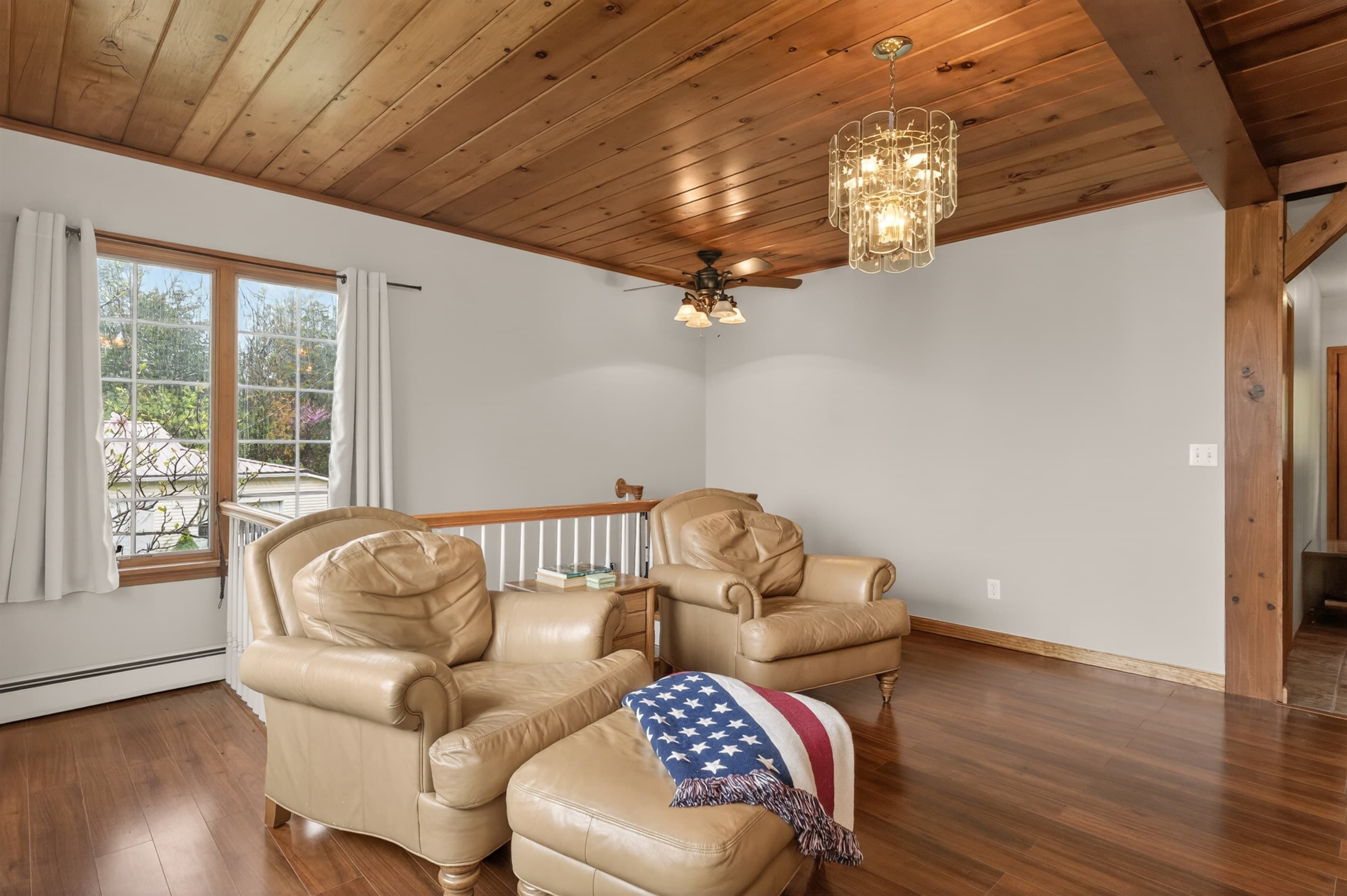 Lounge with leather chairs beneath exposed beams
