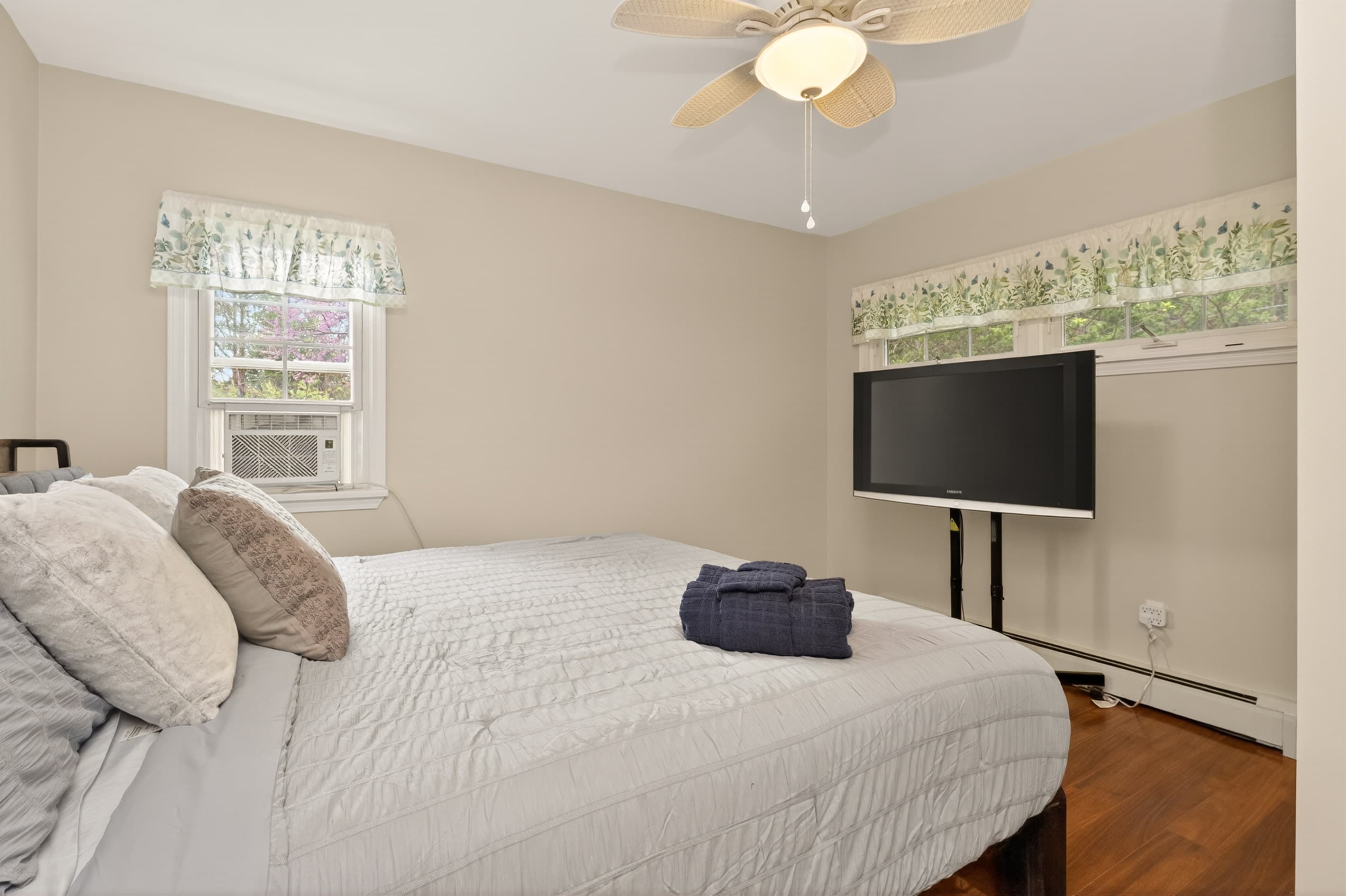 Bedroom with television and window