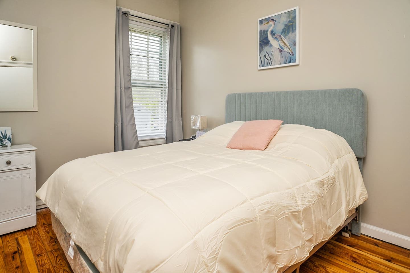 Queen bedroom with light blue headboard